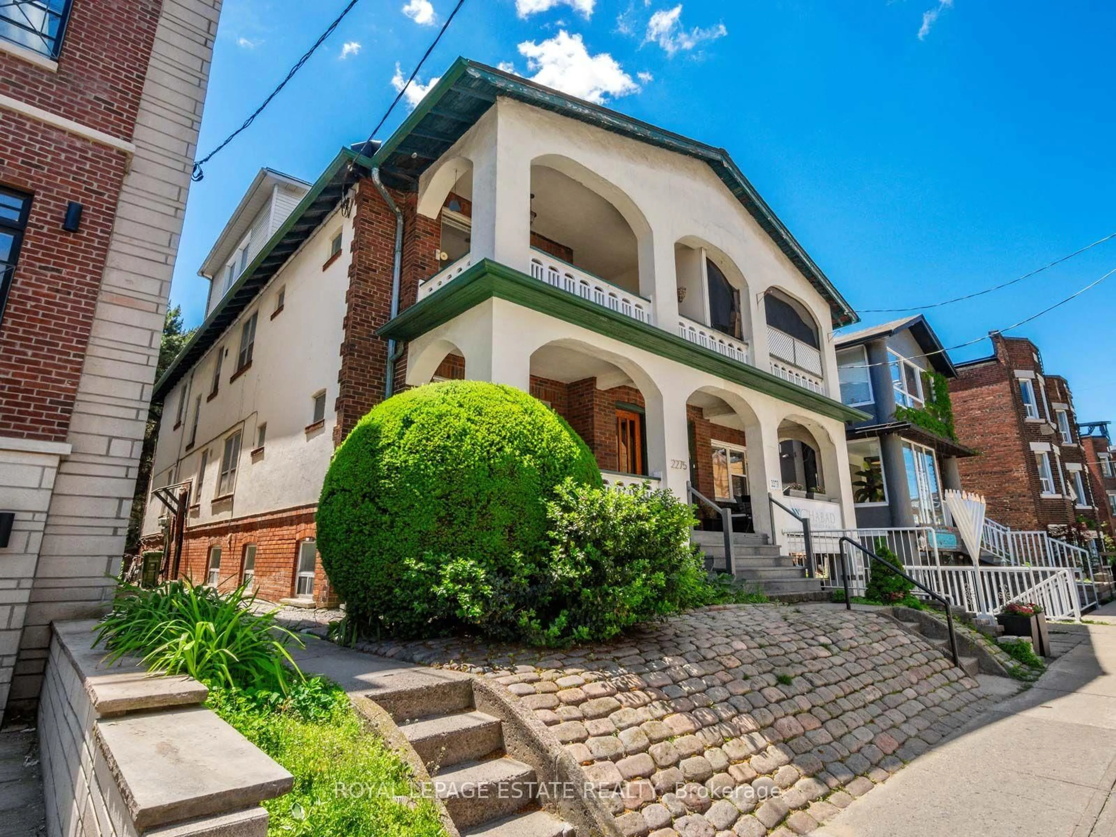Home with brick exterior material, street for 2275 Queen St, Toronto Ontario M4E 1G5