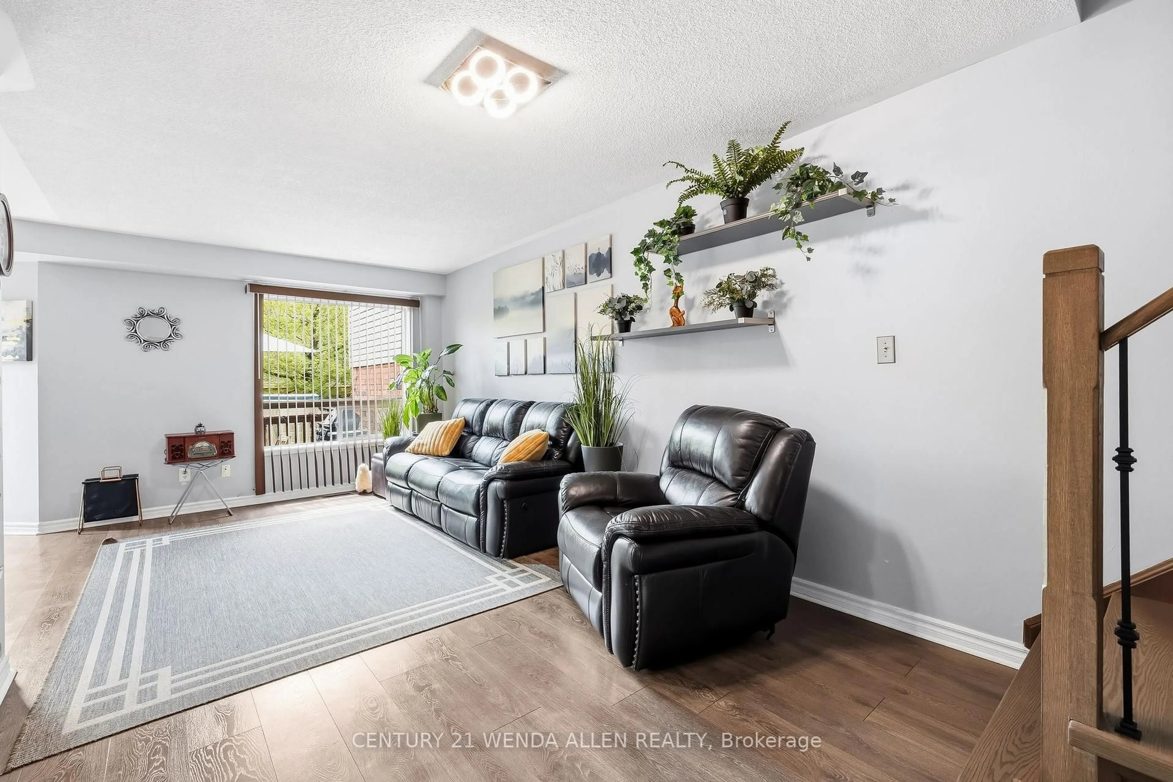 Living room with furniture, wood/laminate floor for 5 Jays Dr, Whitby Ontario L1R 2P5