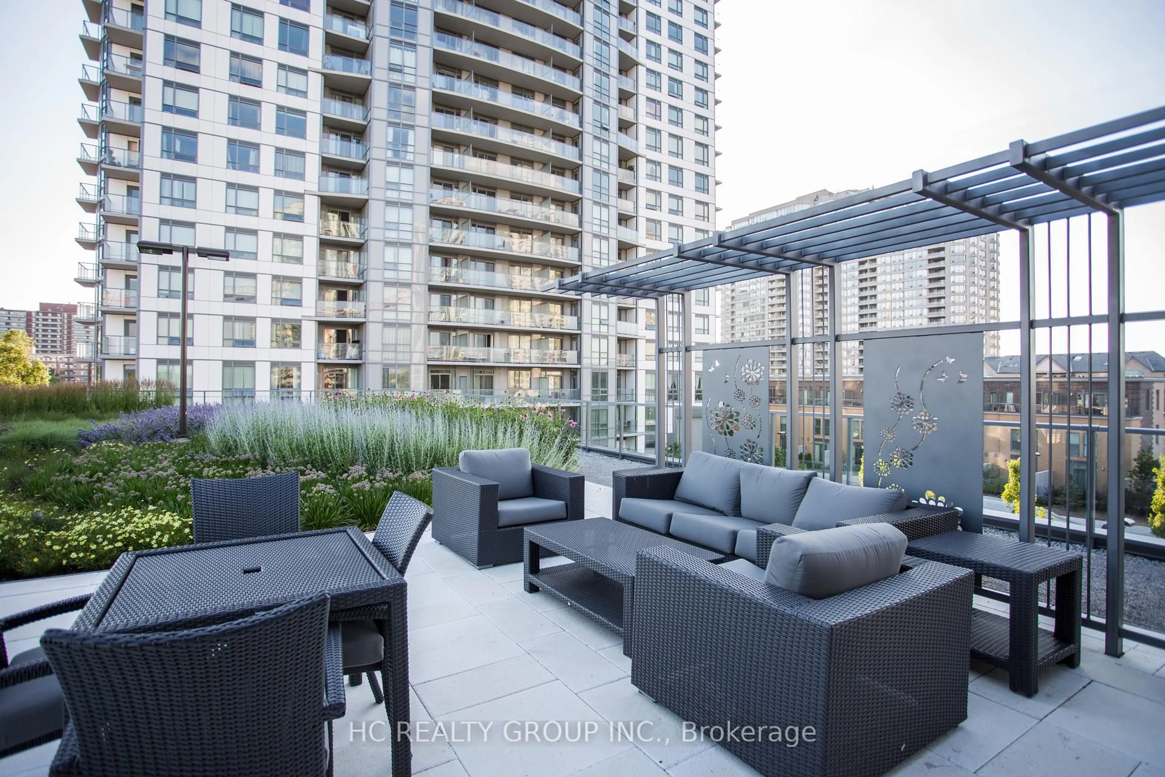 Patio, city buildings view from balcony for 185 Bonis Ave #103, Toronto Ontario M1T 0A4