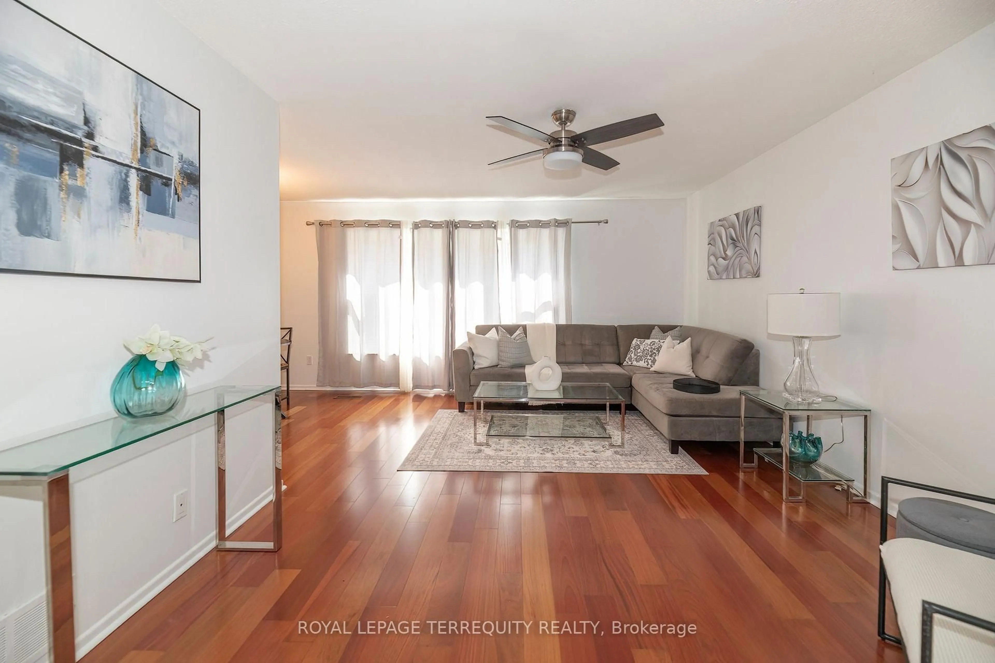 Living room with furniture, wood/laminate floor for 1214 Trowbridge Dr, Oshawa Ontario L1G 7H2