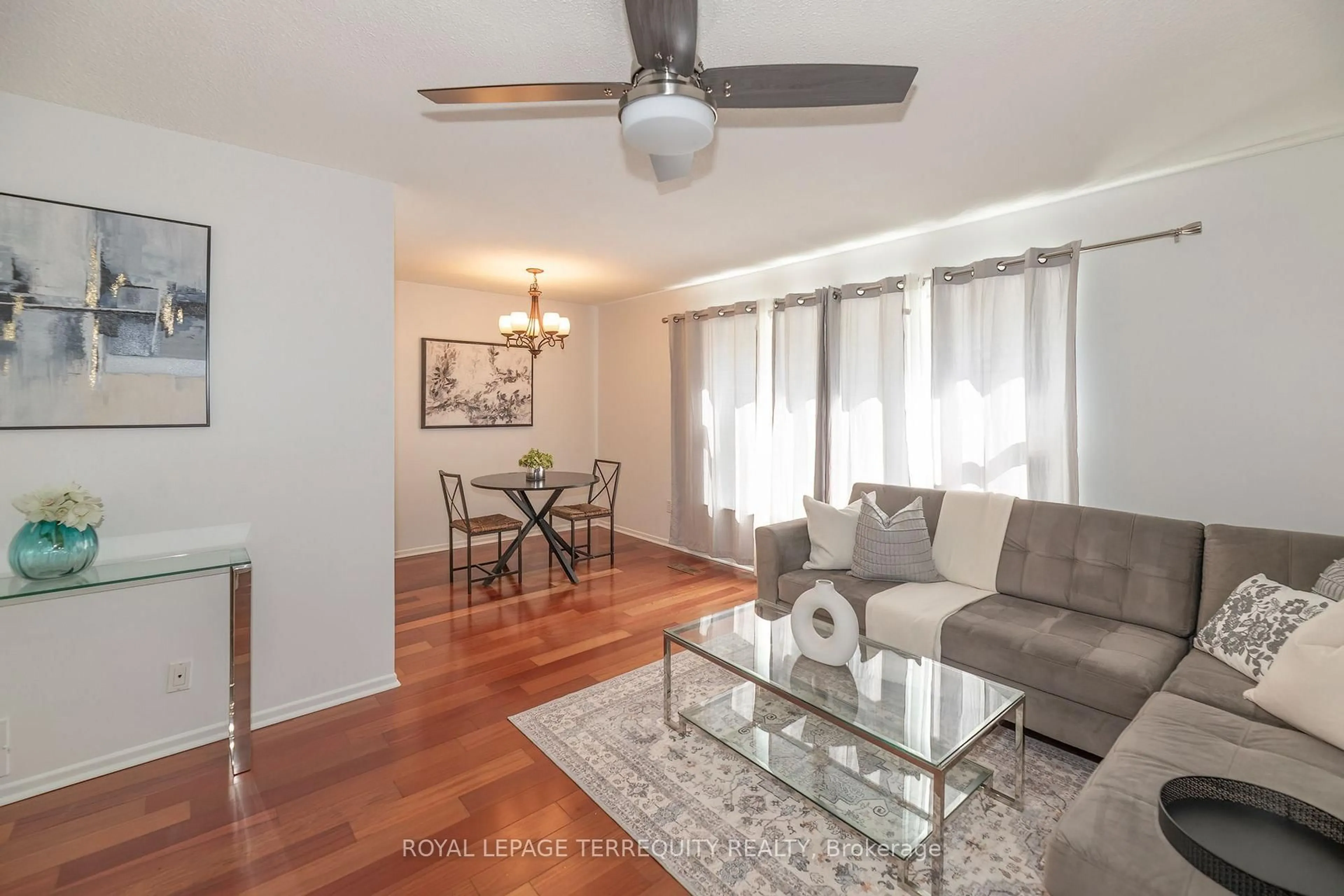 Living room with furniture, wood/laminate floor for 1214 Trowbridge Dr, Oshawa Ontario L1G 7H2