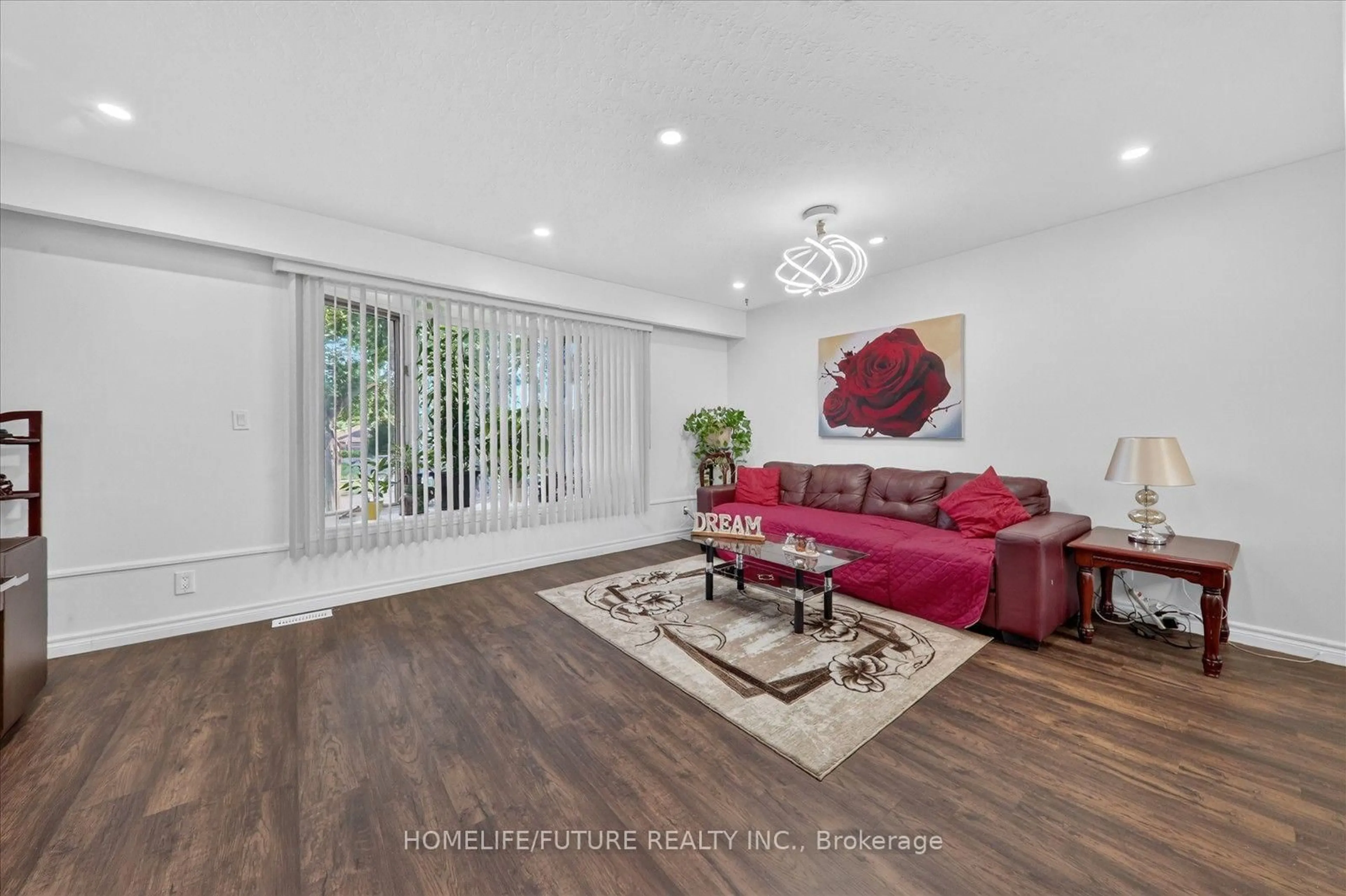 Living room with furniture, wood/laminate floor for 163 Labrador Dr, Oshawa Ontario L1H 7E4
