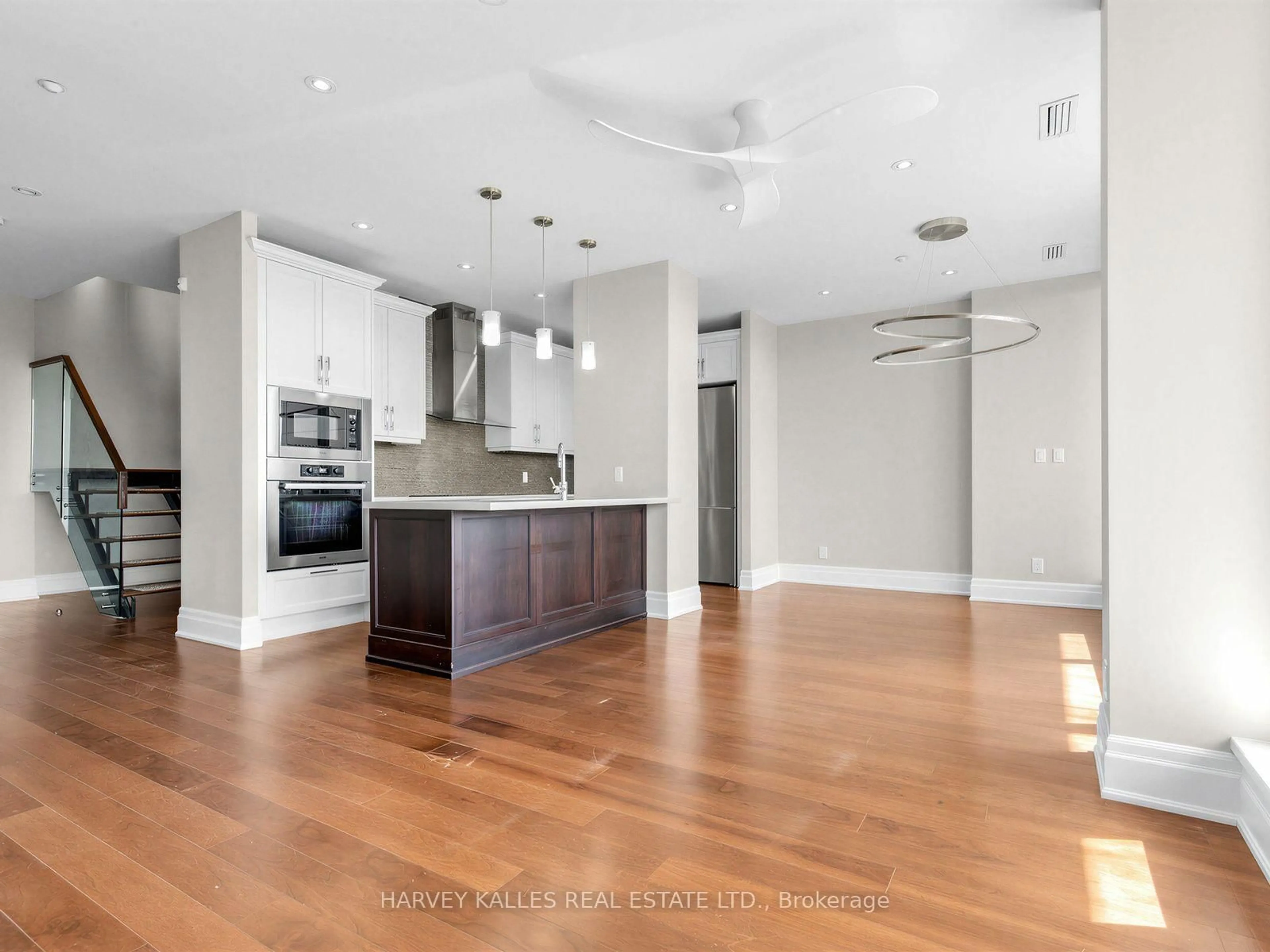 Open concept kitchen, wood/laminate floor for 1 Rainsford Rd #404, Toronto Ontario M4L 3N5