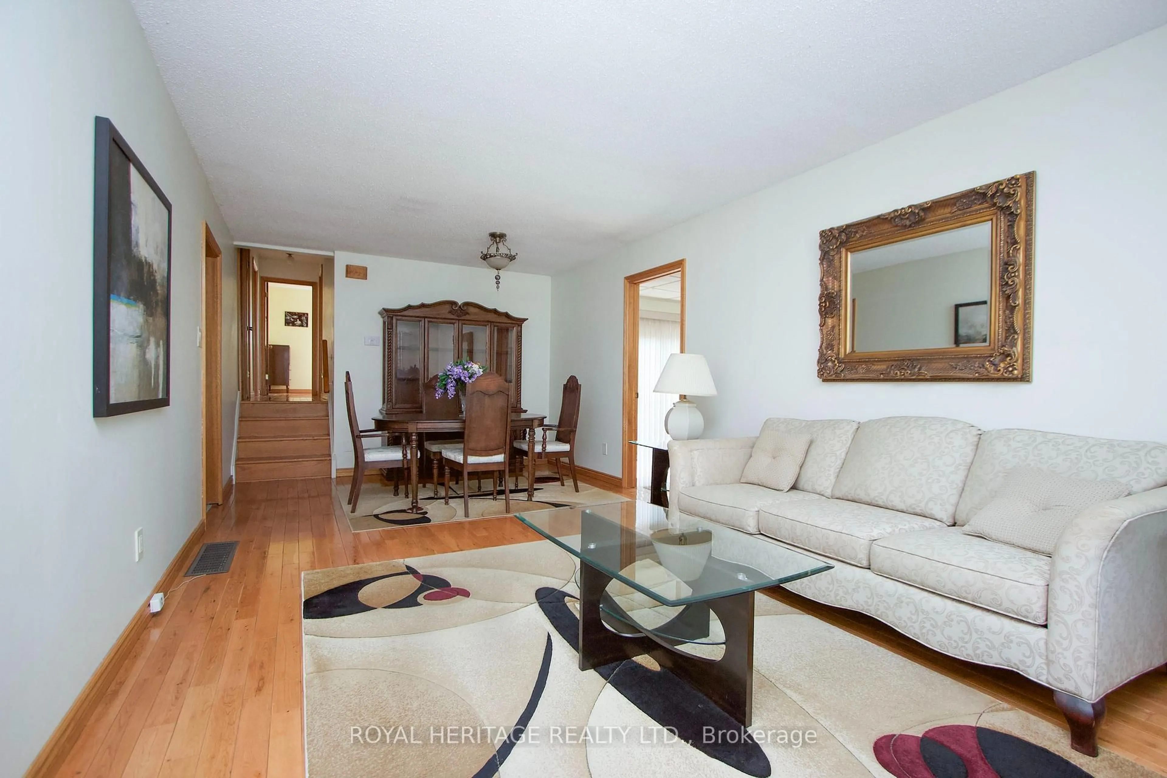 Living room with furniture, wood/laminate floor for 718 Annes St, Whitby Ontario L1N 6B2