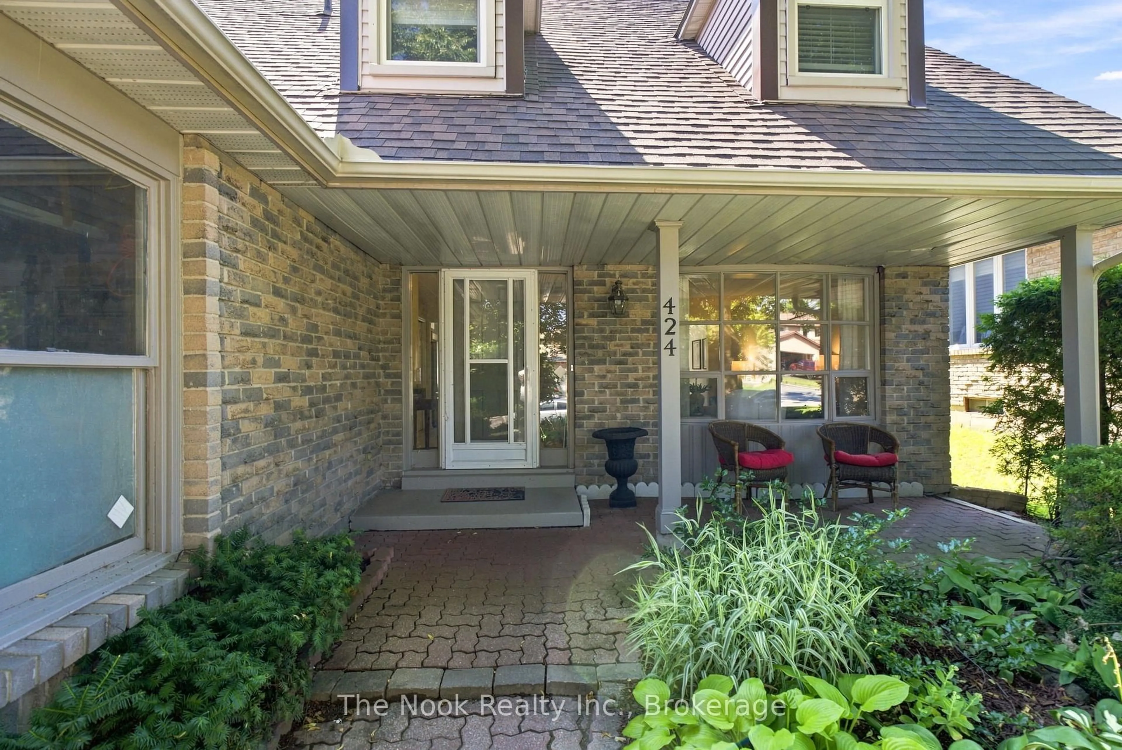 Home with brick exterior material, street for 424 Prince Of Wales Dr, Whitby Ontario L1N 6M9