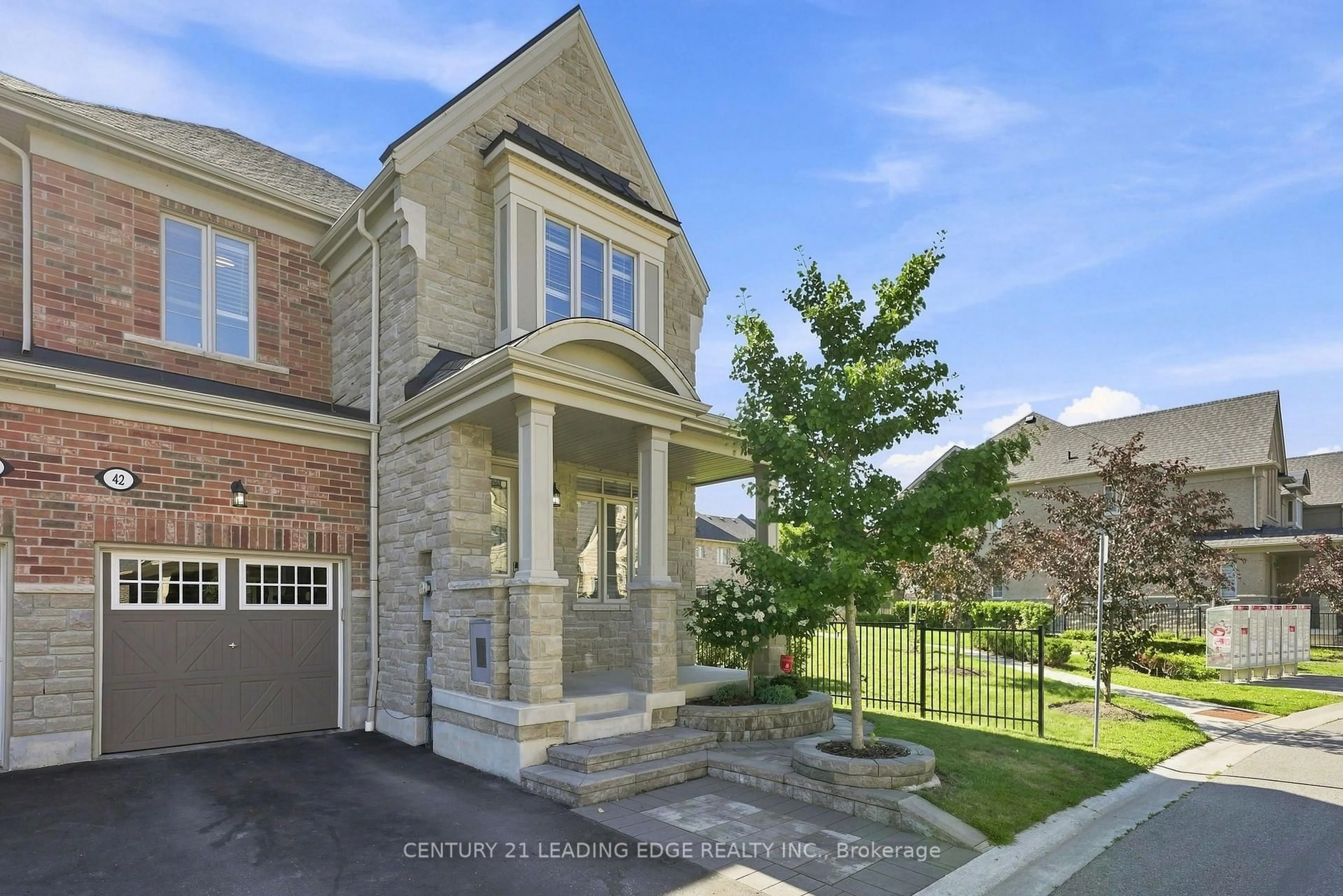 Home with brick exterior material, street for 42 Workmens Circ, Ajax Ontario L1T 0N7