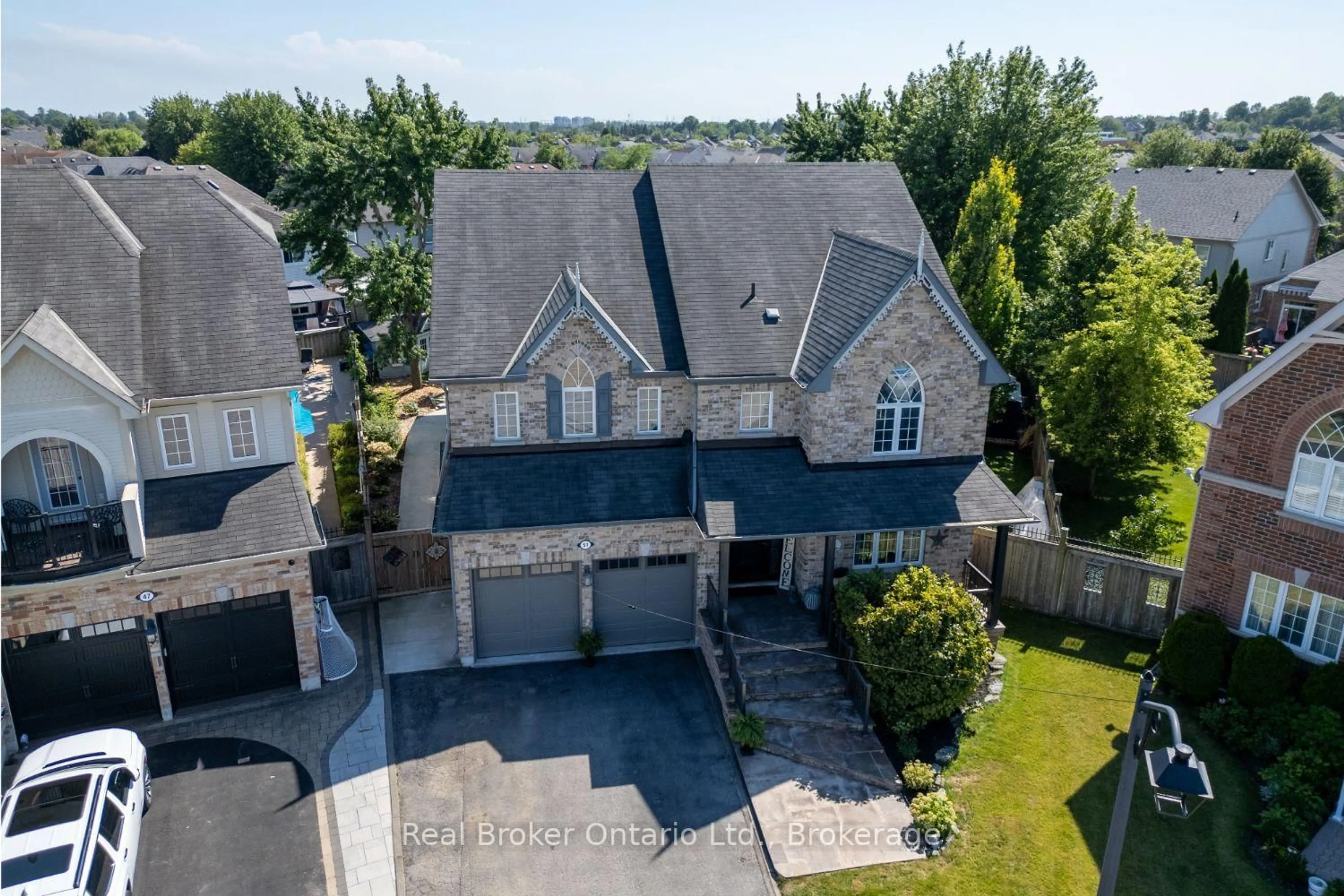 A pic from outside/outdoor area/front of a property/back of a property/a pic from drone, unknown for 51 Brough Crt, Clarington Ontario L1C 0B7