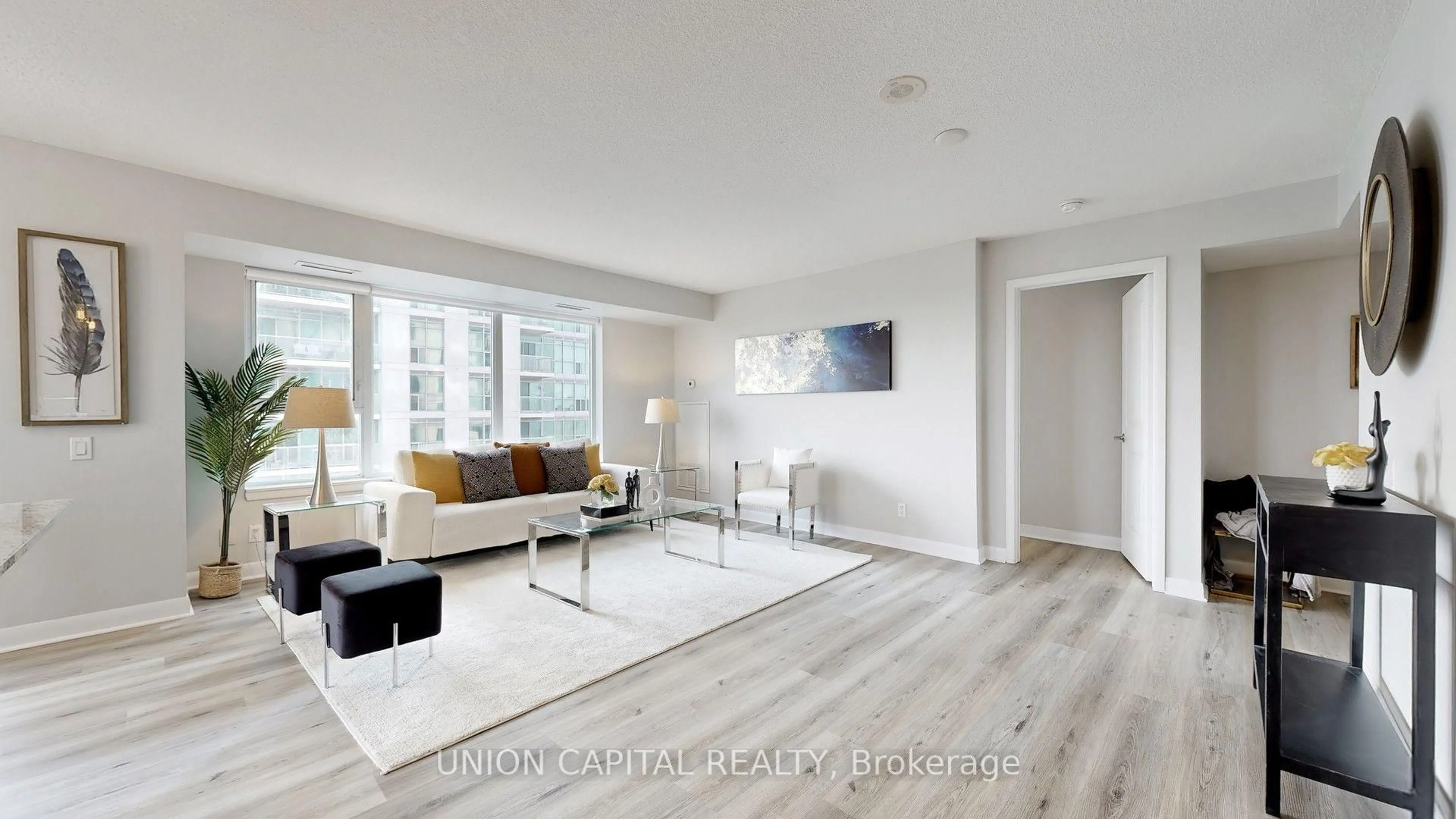 Living room with furniture, wood/laminate floor for 25 Town Centre Crt #1608, Toronto Ontario M1P 0B4