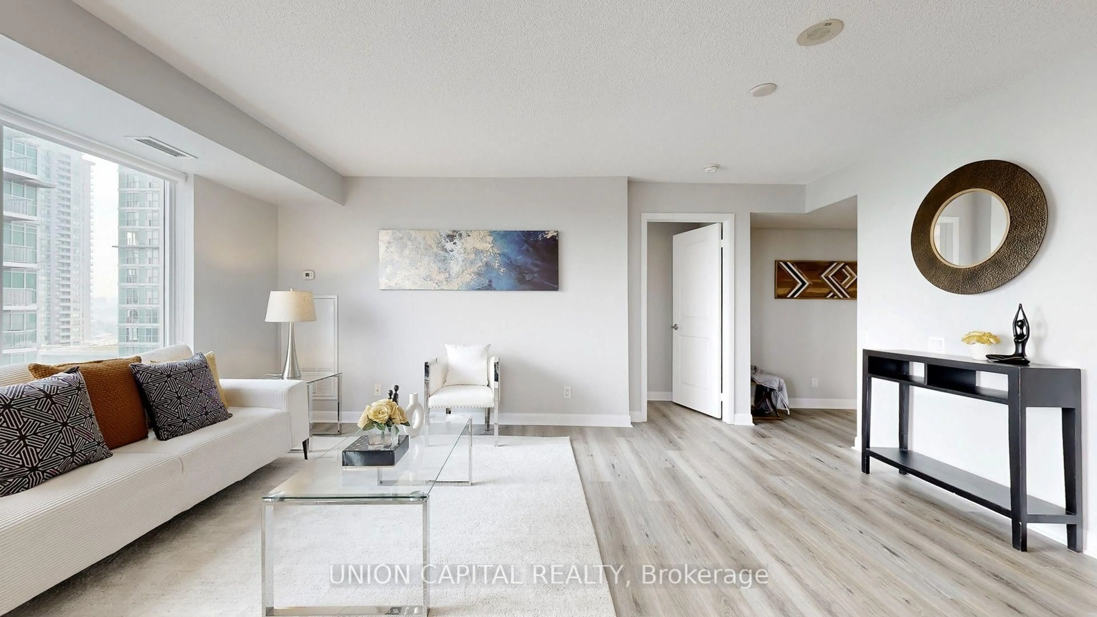 Living room with furniture, wood/laminate floor for 25 Town Centre Crt #1608, Toronto Ontario M1P 0B4