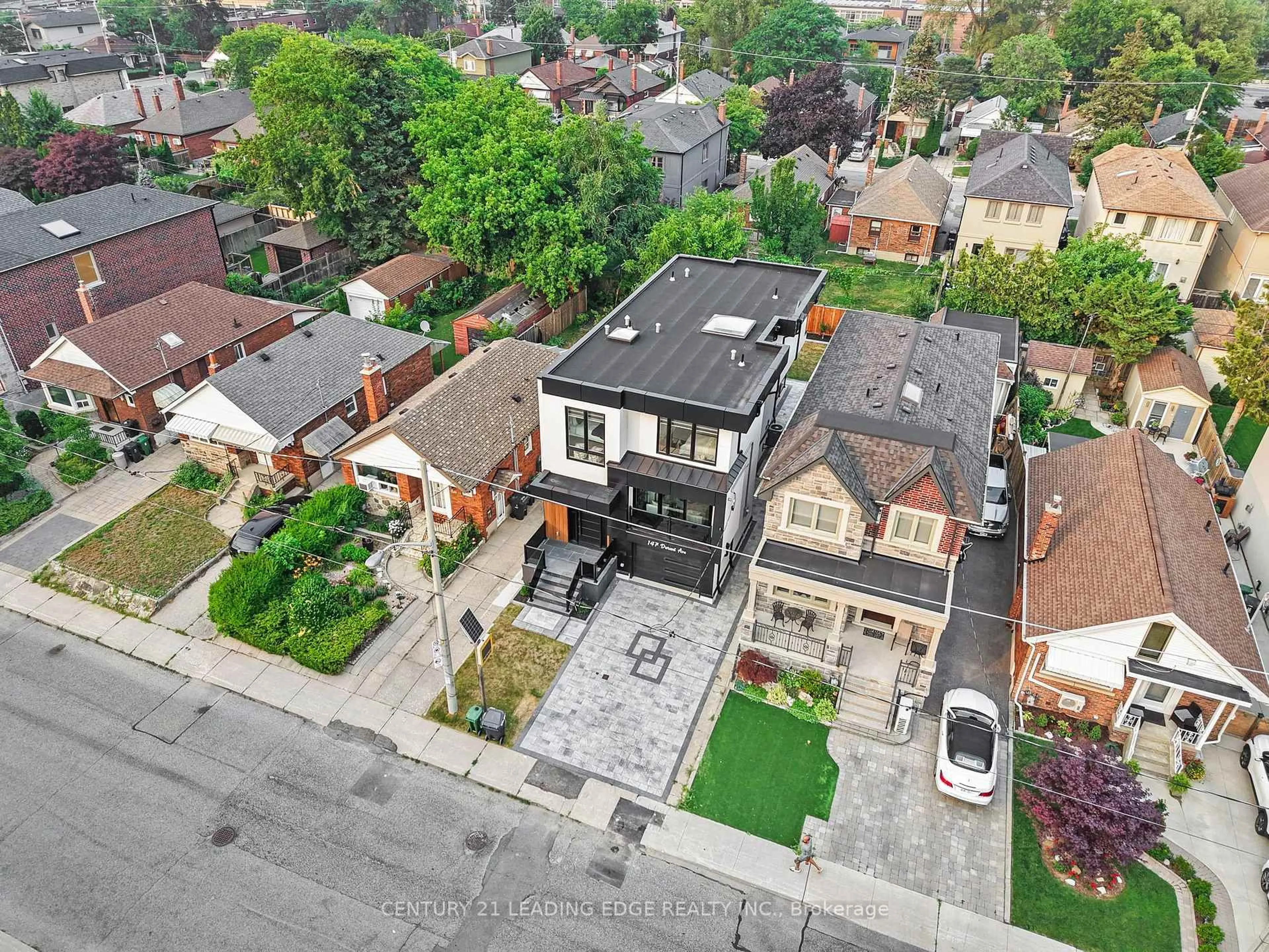 A pic from outside/outdoor area/front of a property/back of a property/a pic from drone, street for 147 Durant Ave, Toronto Ontario M4J 4W4