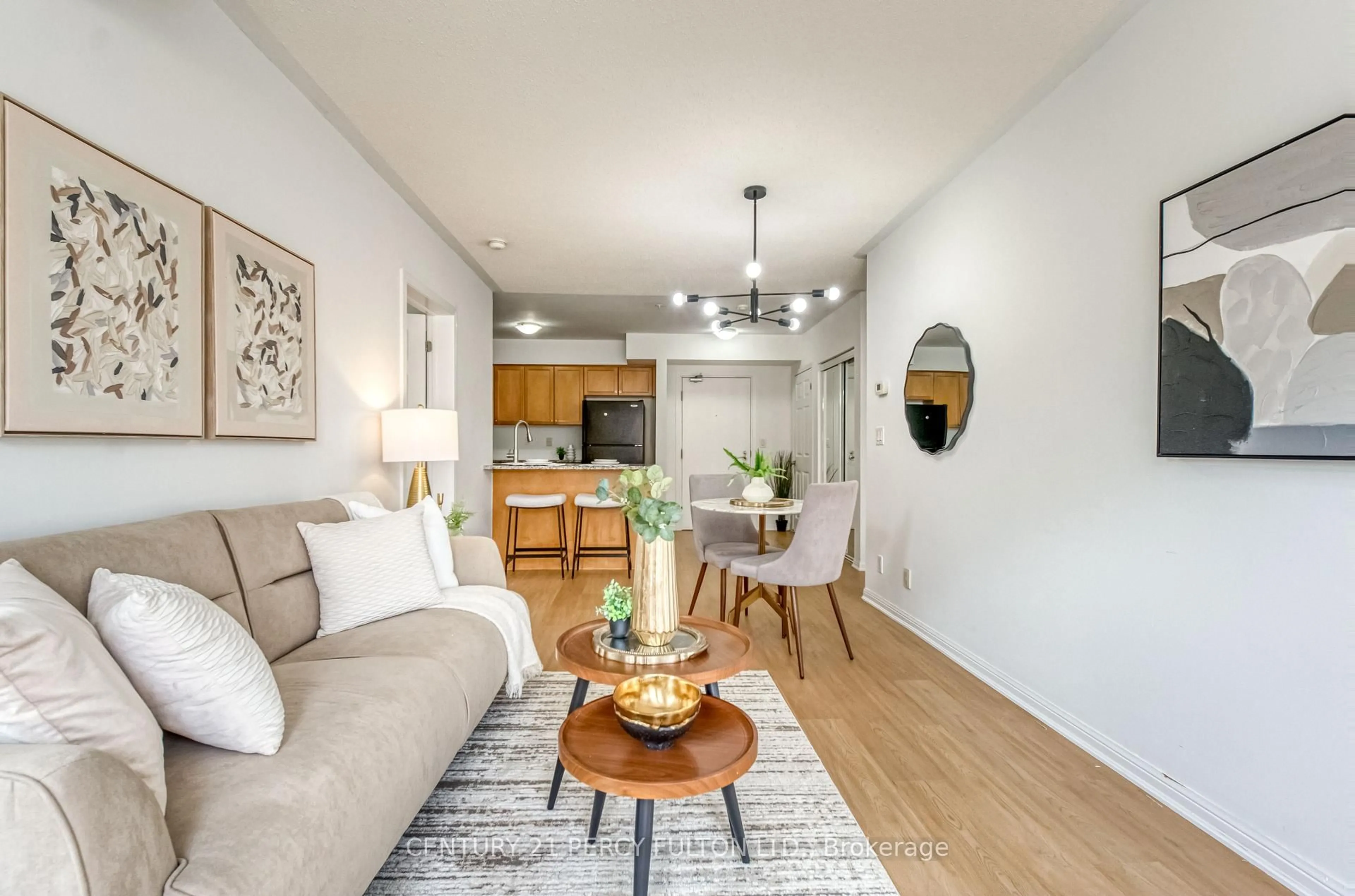 Living room with furniture, wood/laminate floor for 60 Mendelssohn St #203, Toronto Ontario M1L 0G9