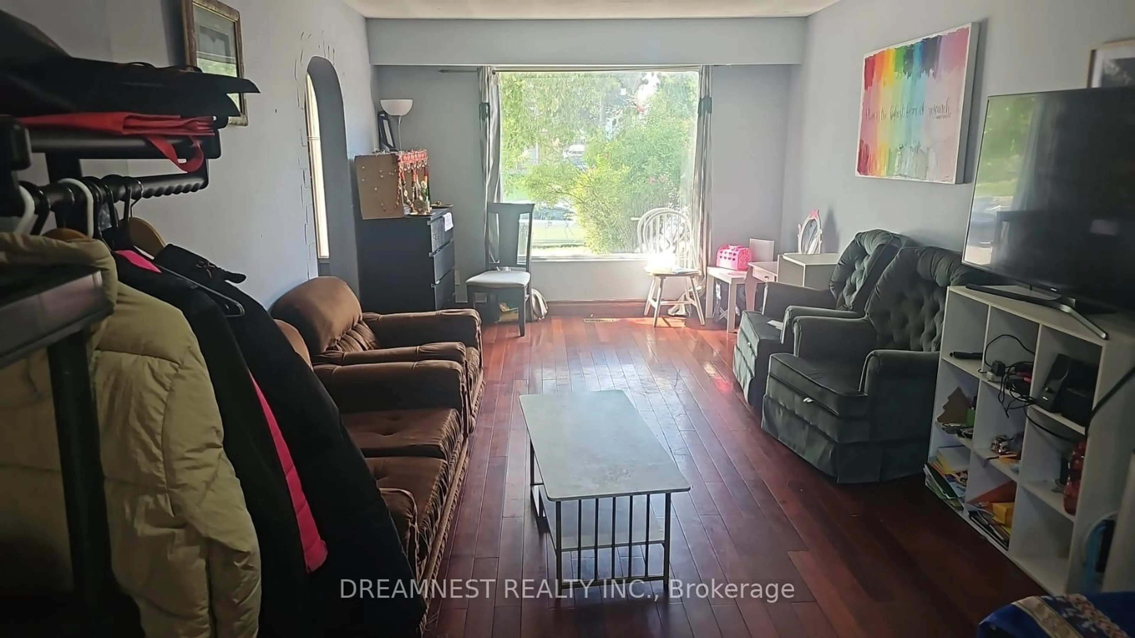 Living room with furniture, wood/laminate floor for 59 Coxworth Cres, Toronto Ontario M1B 1E2