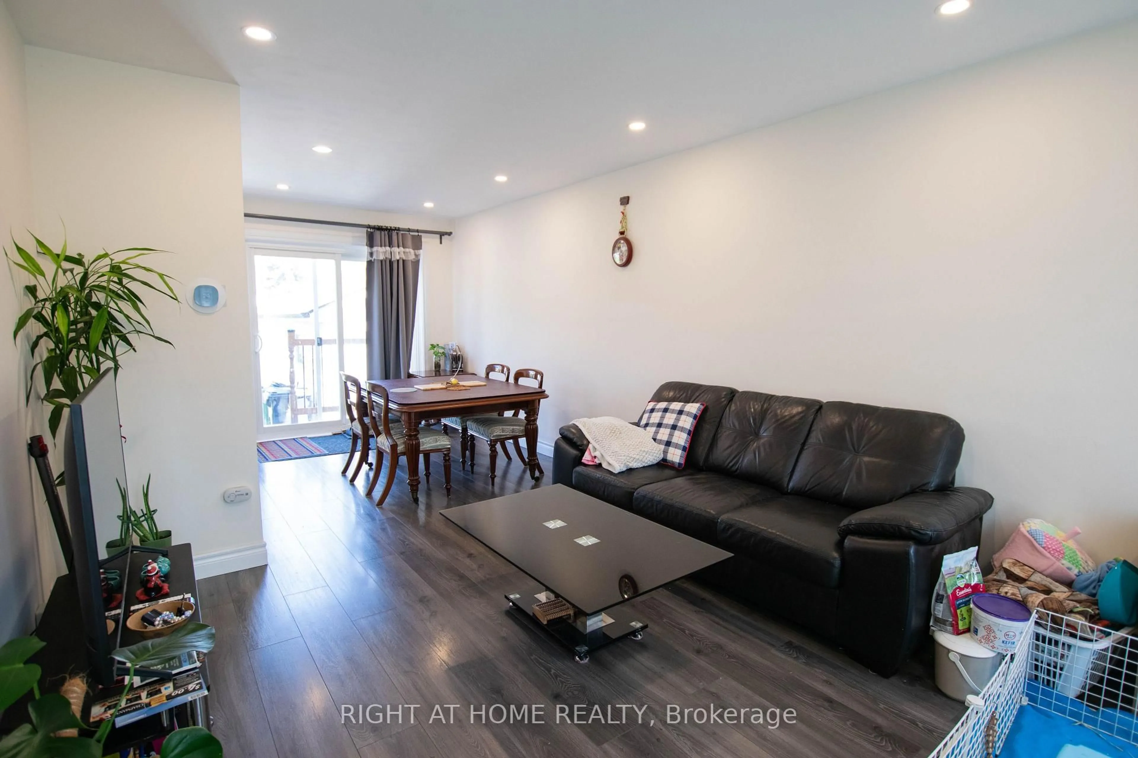 Living room with furniture, wood/laminate floor for 32 Ellendale Dr, Toronto Ontario M1P 1N2