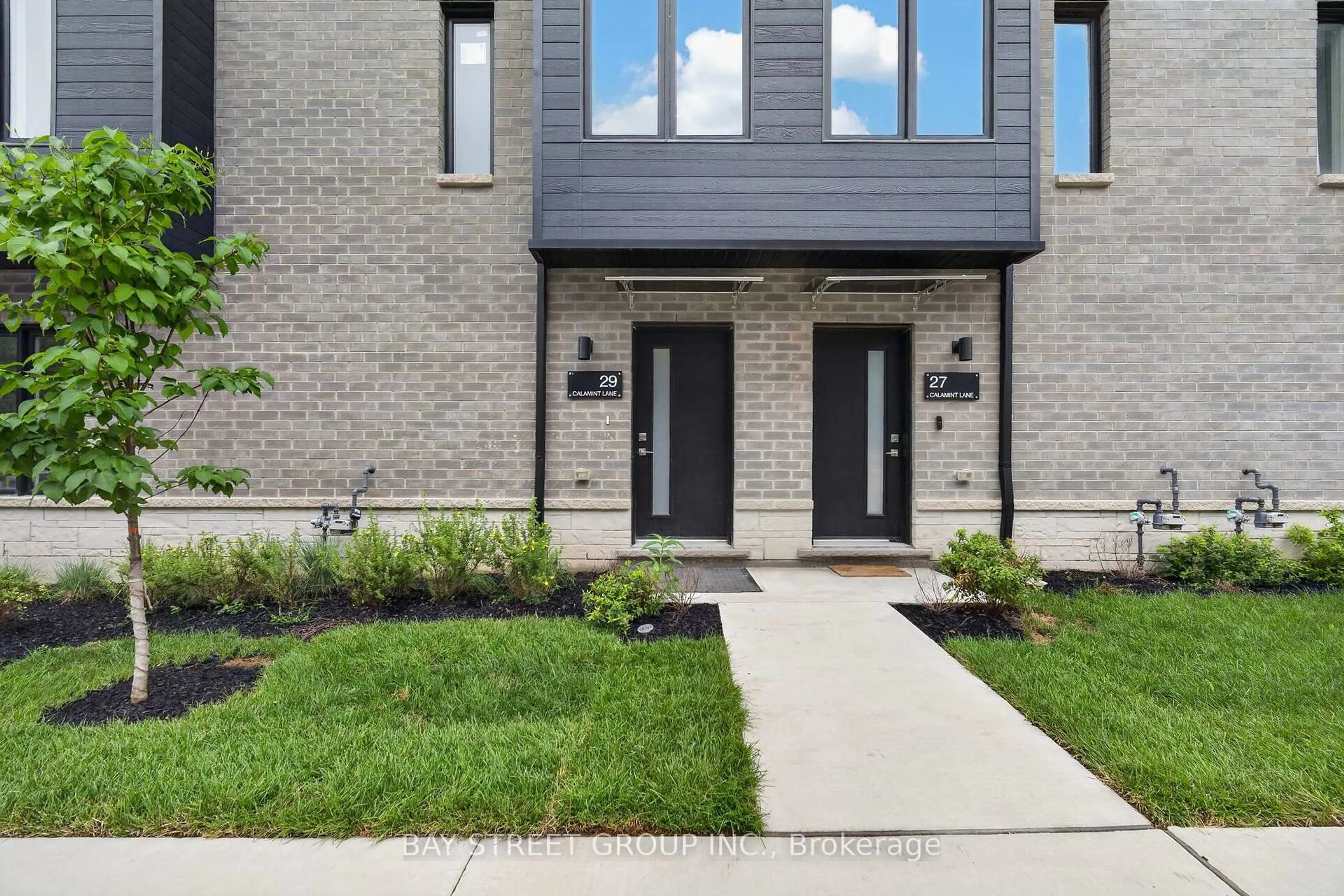 Home with brick exterior material, street for 29 Calamint Lane, Toronto Ontario M1W 2H1