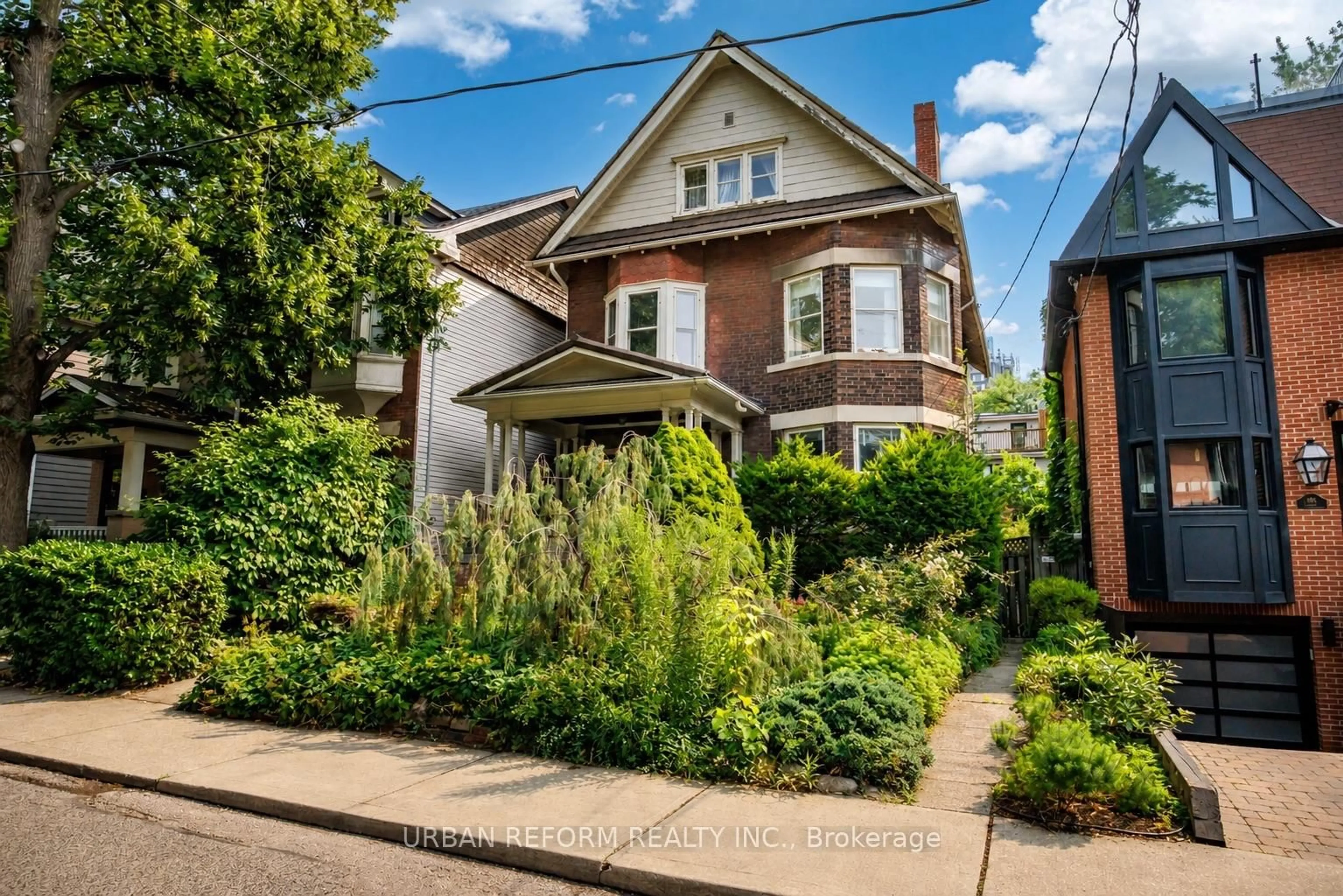 Home with brick exterior material, street for 197 De Grassi St, Toronto Ontario M4M 2K8