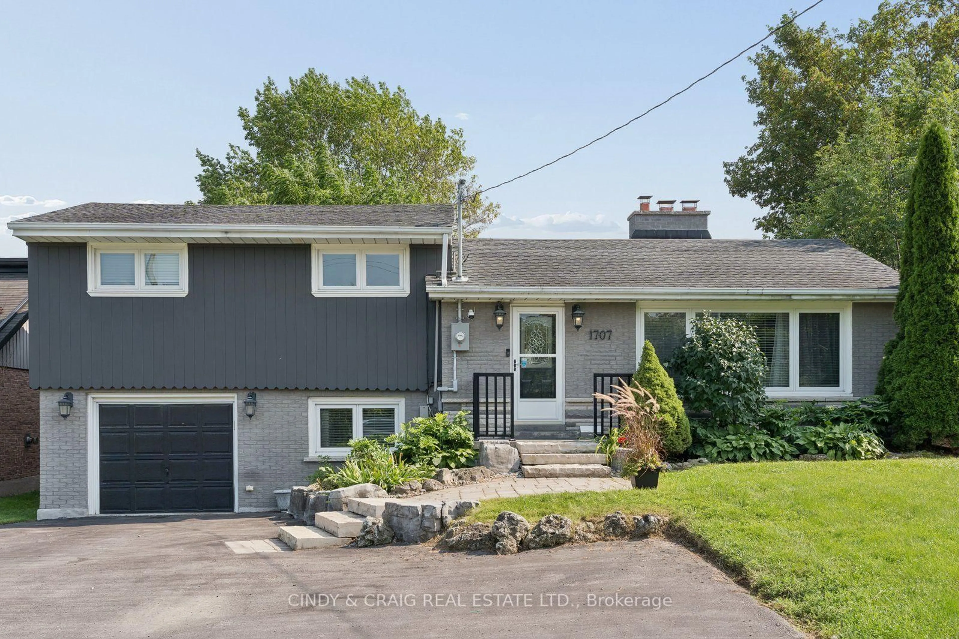 Home with vinyl exterior material, street for 1707 Highway 2 Rd, Clarington Ontario L1E 0A3