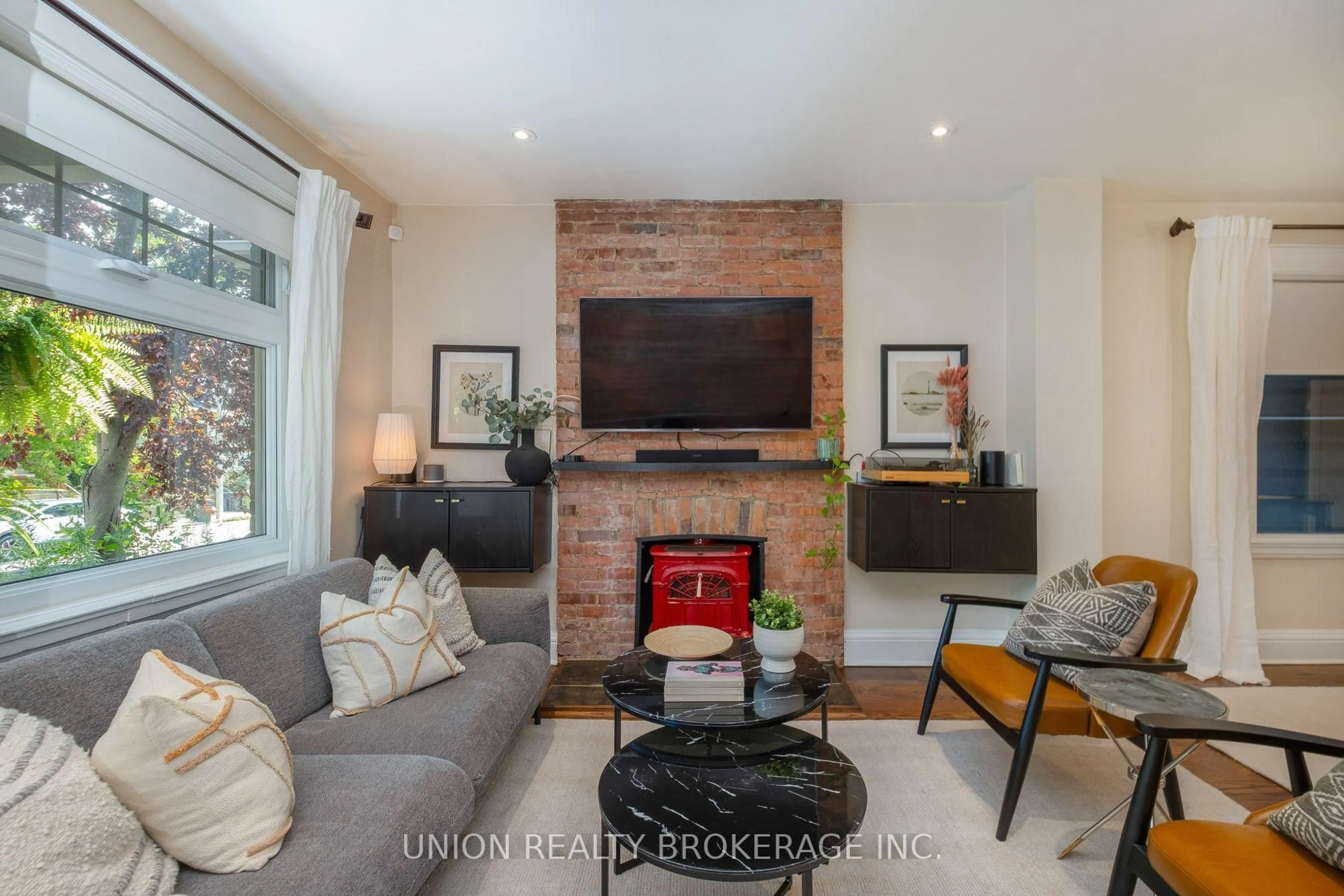 Living room with furniture, wood/laminate floor for 706 Woodbine Ave, Toronto Ontario M4E 2J1