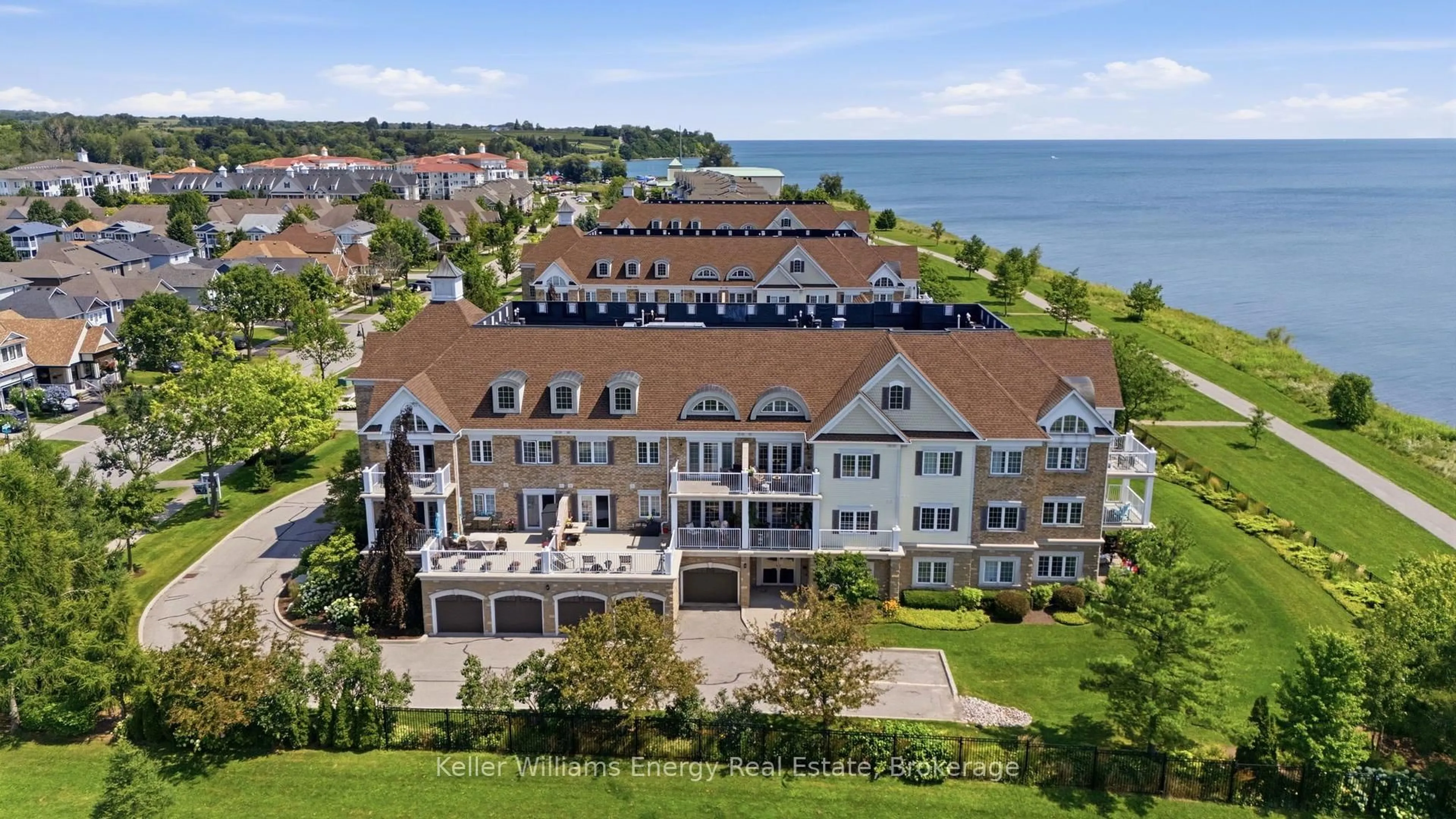 A pic from outside/outdoor area/front of a property/back of a property/a pic from drone, water/lake/river/ocean view for 395 LAKEBREEZE Dr #308, Clarington Ontario L1B 0A5