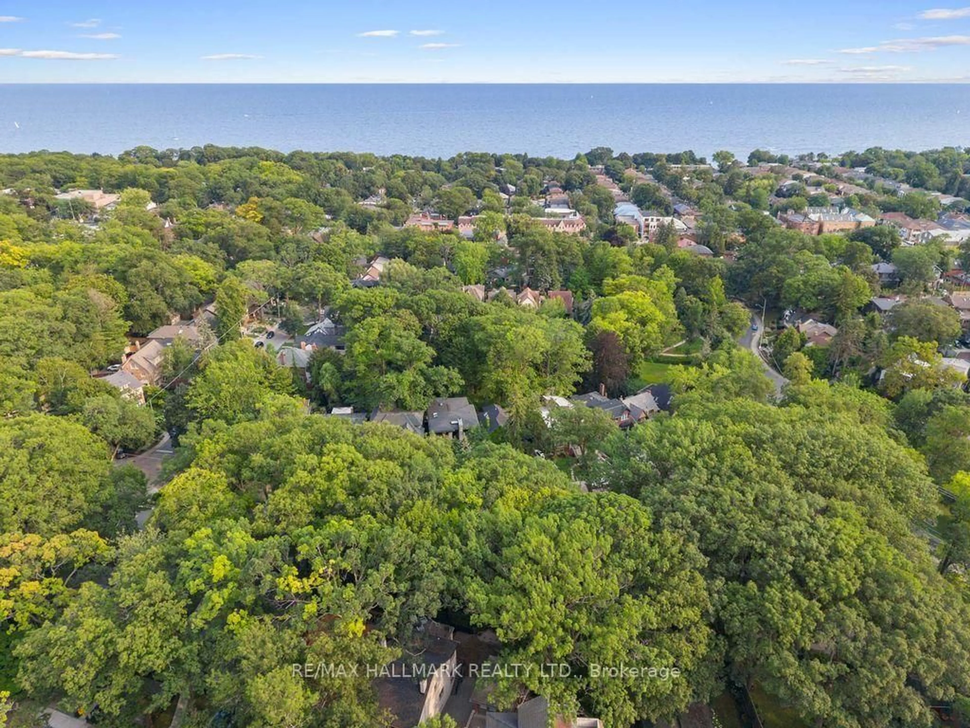 A pic from outside/outdoor area/front of a property/back of a property/a pic from drone, forest/trees view for 14 Pine Cres, Toronto Ontario M4E 1L2