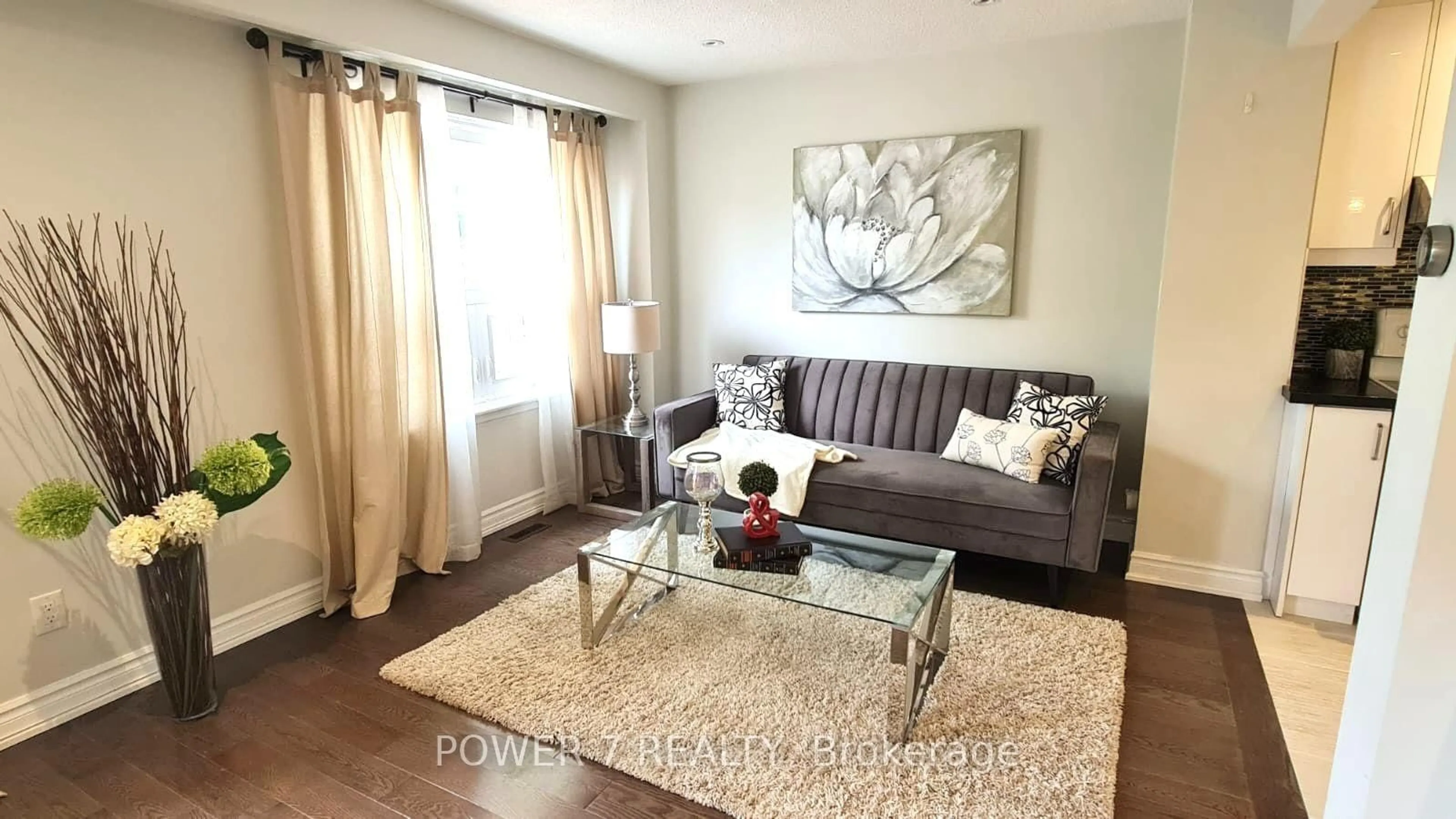 Living room with furniture, wood/laminate floor for 139 Carolbreen Sq, Toronto Ontario M1V 1J1