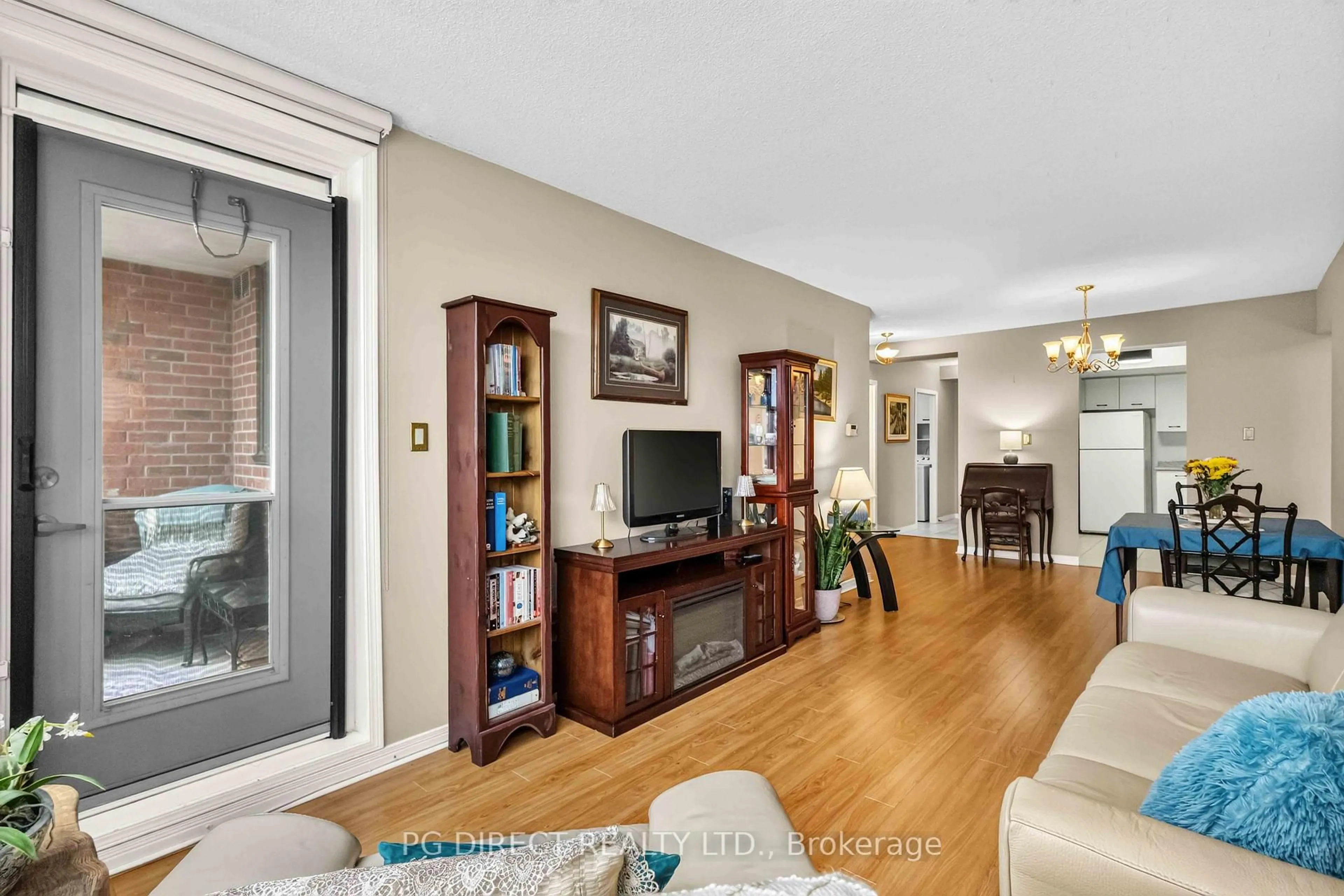 Living room with furniture, wood/laminate floor for 80 Athol St #604, Oshawa Ontario L1H 8B7