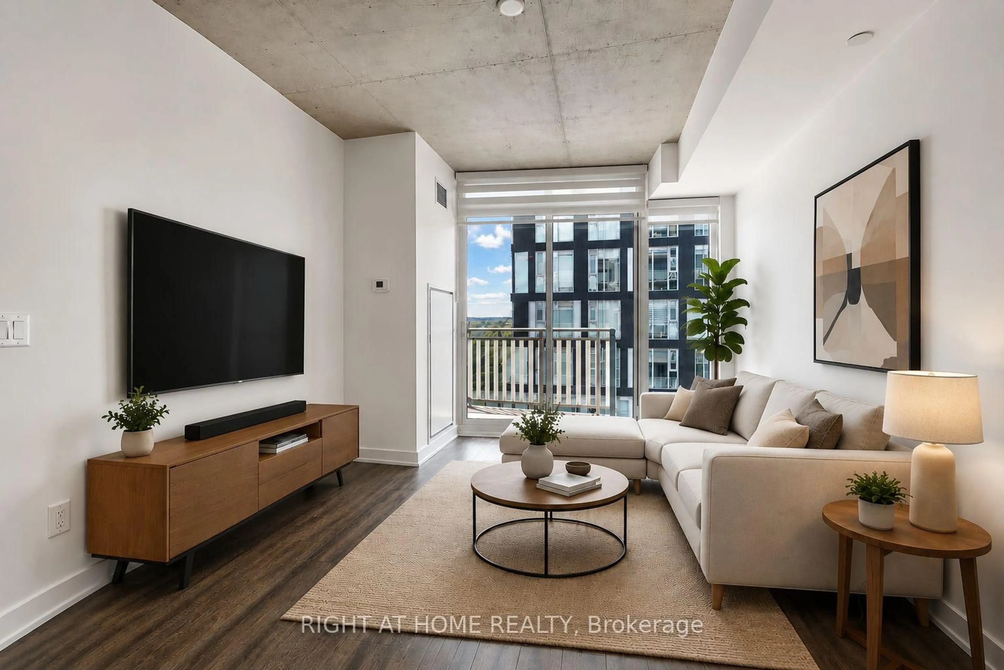 Living room with furniture, cement floor for 45 BASEBALL Pl #903, Toronto Ontario M4M 0H1