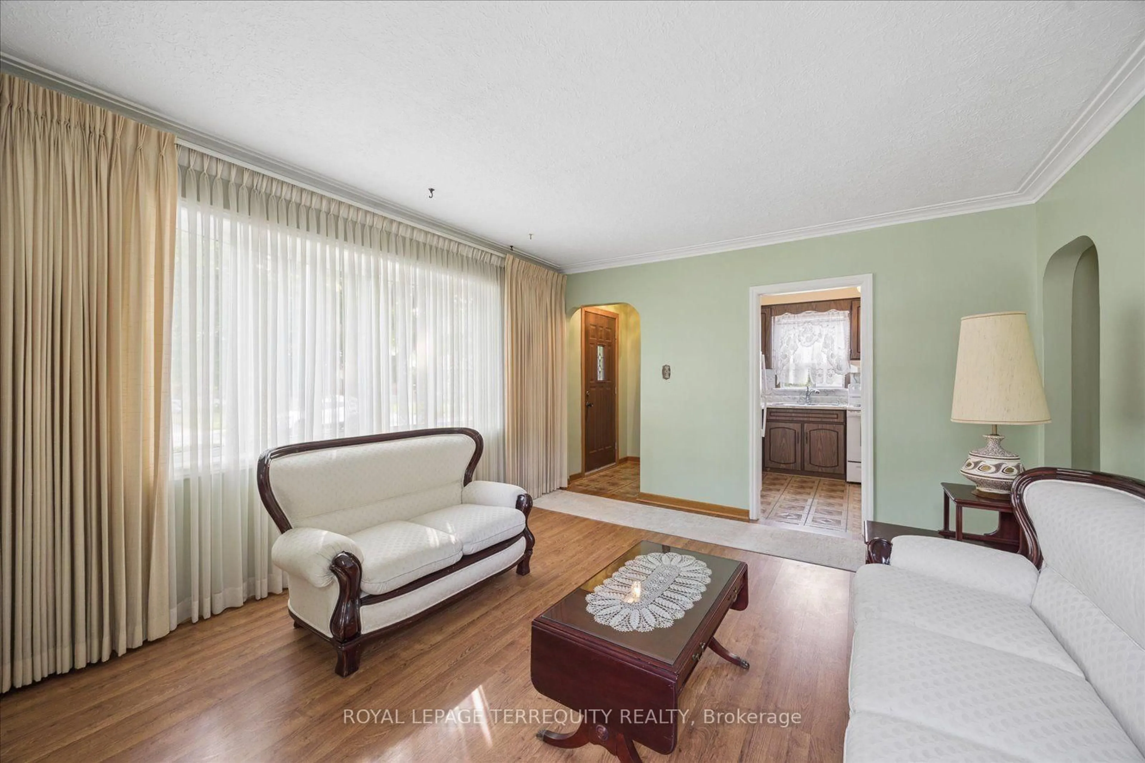 Living room with furniture, wood/laminate floor for 120 Ellington Dr, Toronto Ontario M1R 3Y3
