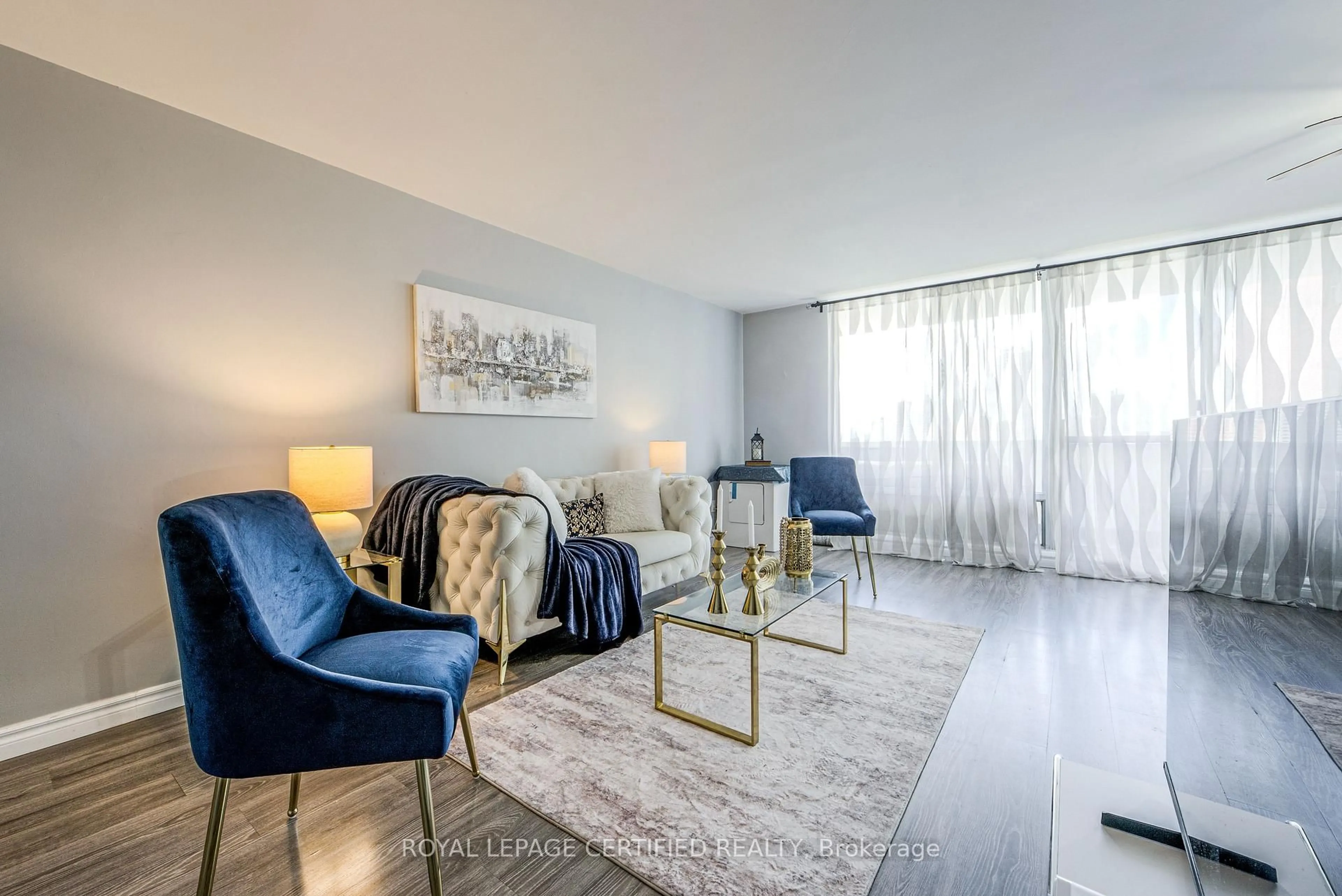 Living room with furniture, unknown for 1 Massey Sq #1208, Toronto Ontario M4C 5L4