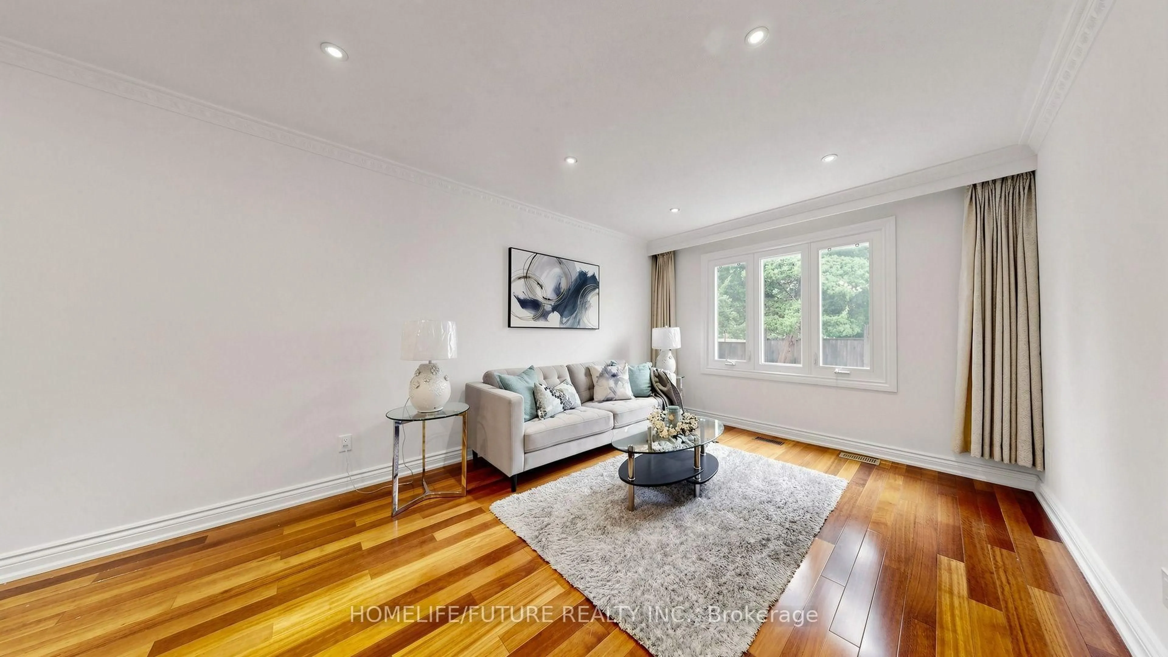 Living room with furniture, wood/laminate floor for 69 Lansbury Dr, Toronto Ontario M1V 3J3