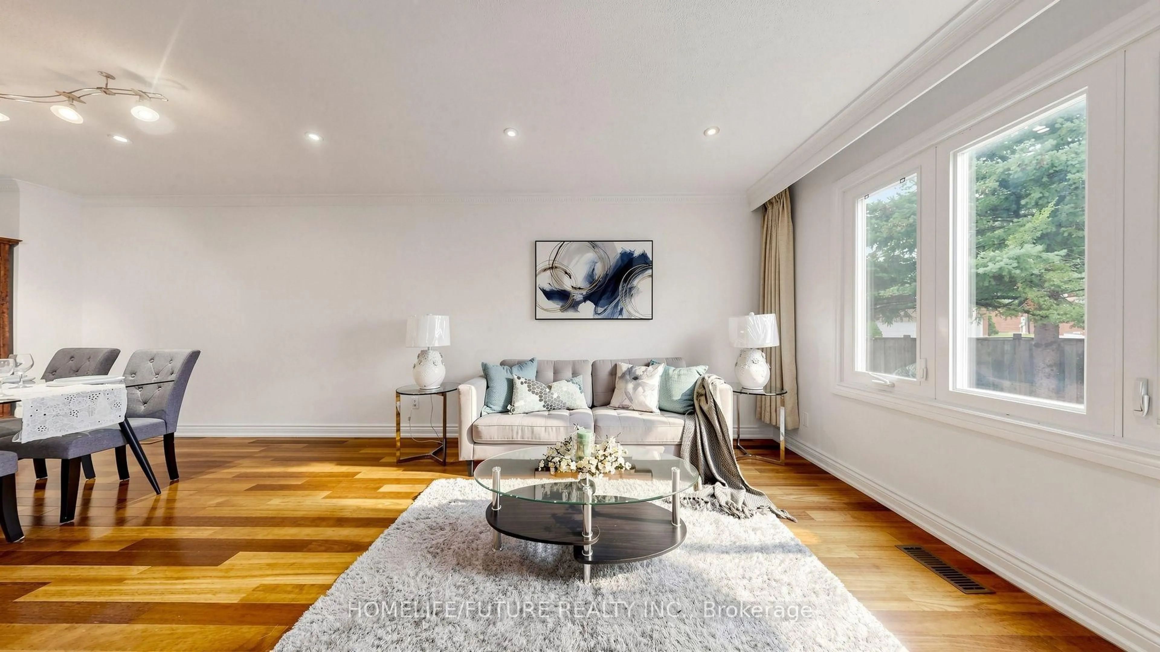 Living room with furniture, wood/laminate floor for 69 Lansbury Dr, Toronto Ontario M1V 3J3