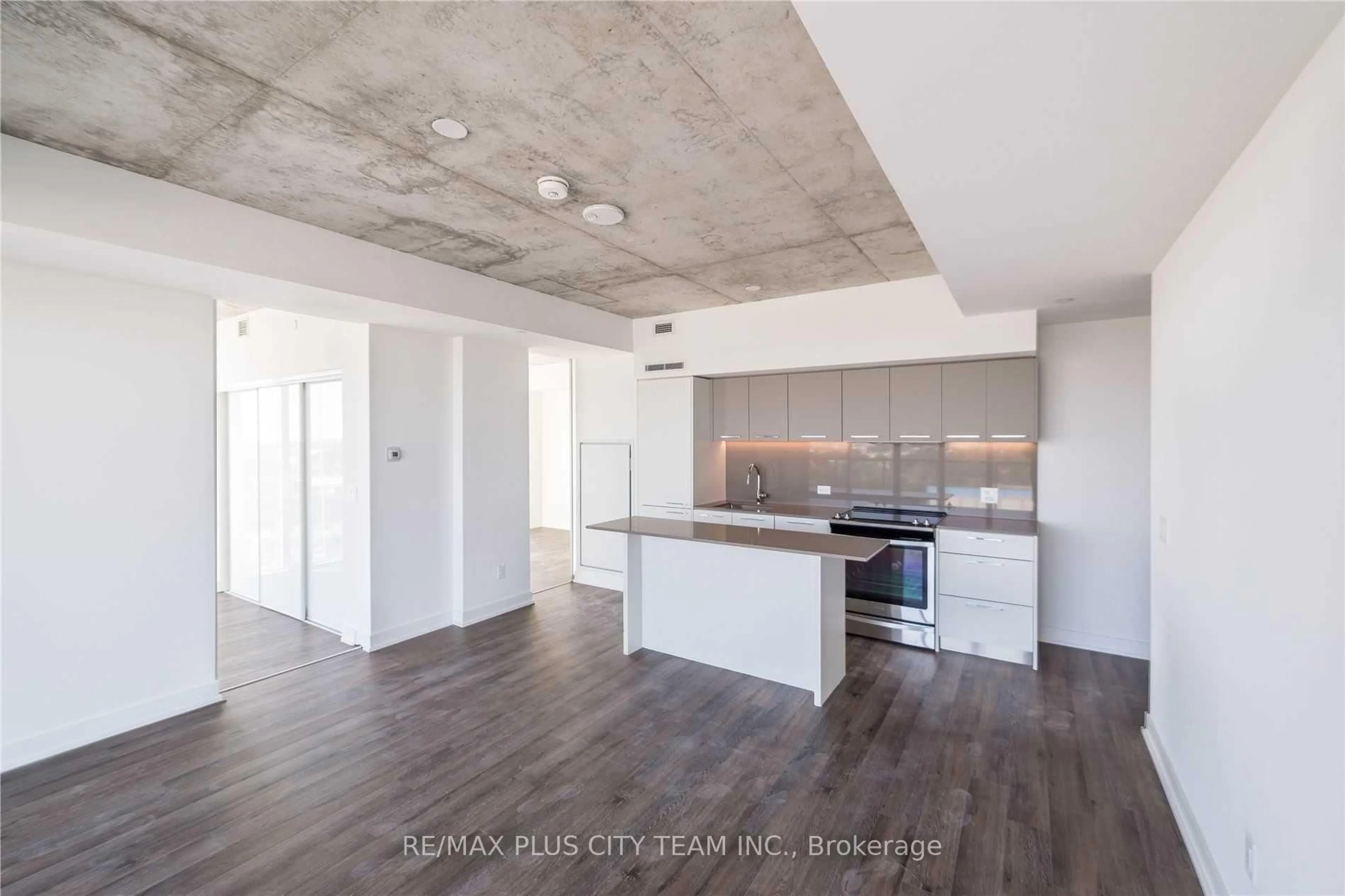 Open concept kitchen, cement floor for 15 Baseball Pl #1504, Toronto Ontario M4M 0E6
