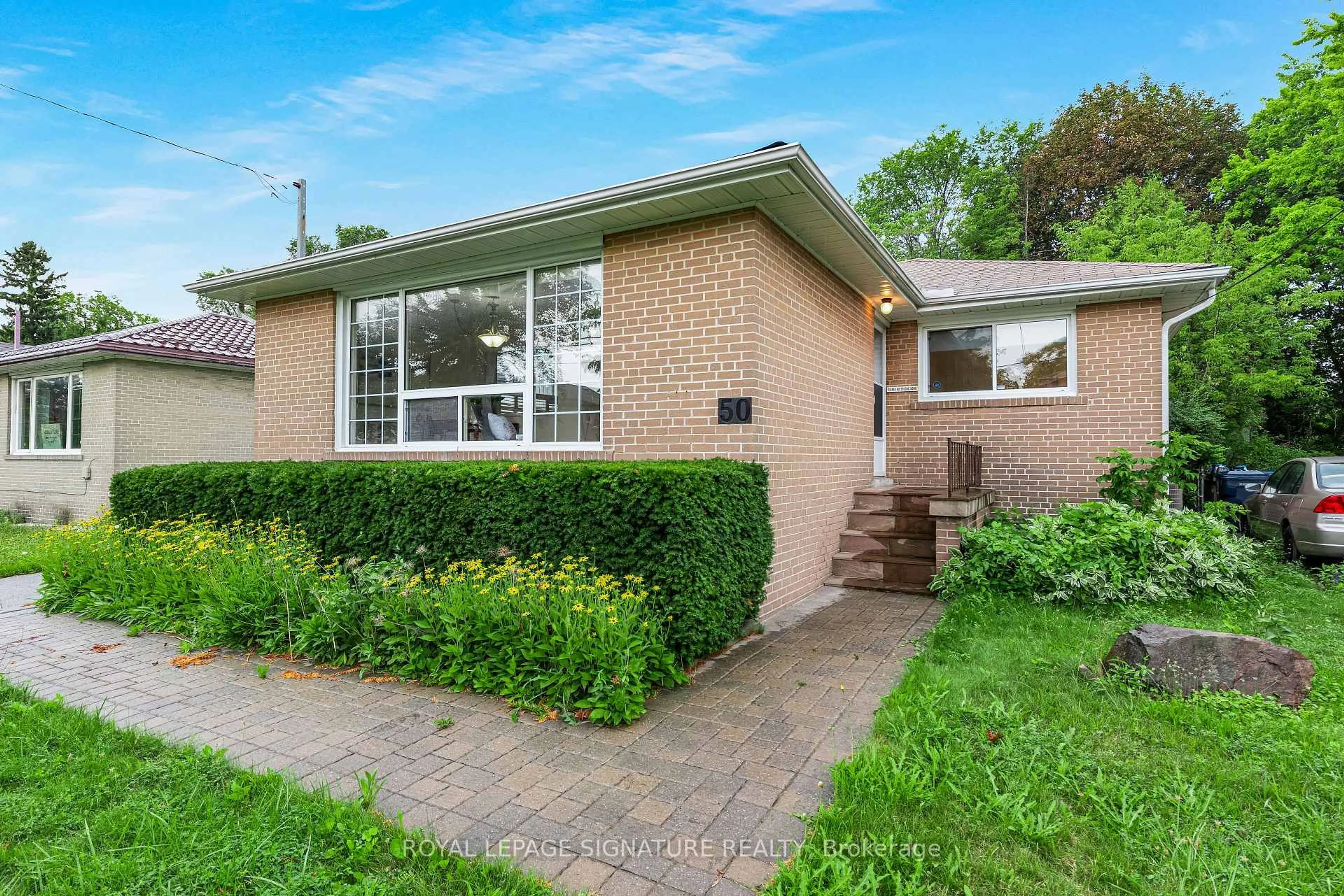 Home with brick exterior material, street for 50 Celeste Dr, Toronto Ontario M1E 2V1
