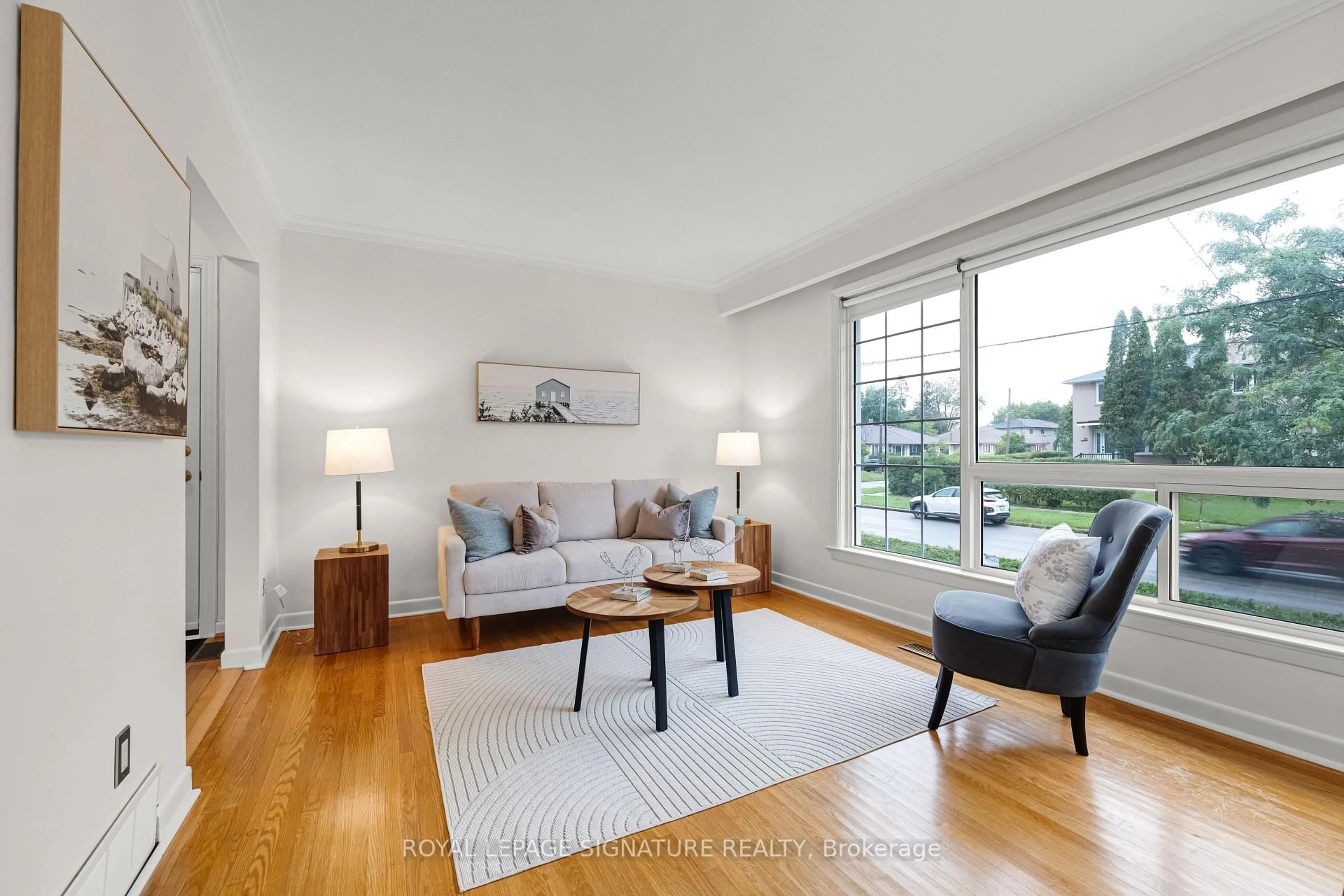 Living room with furniture, wood/laminate floor for 50 Celeste Dr, Toronto Ontario M1E 2V1