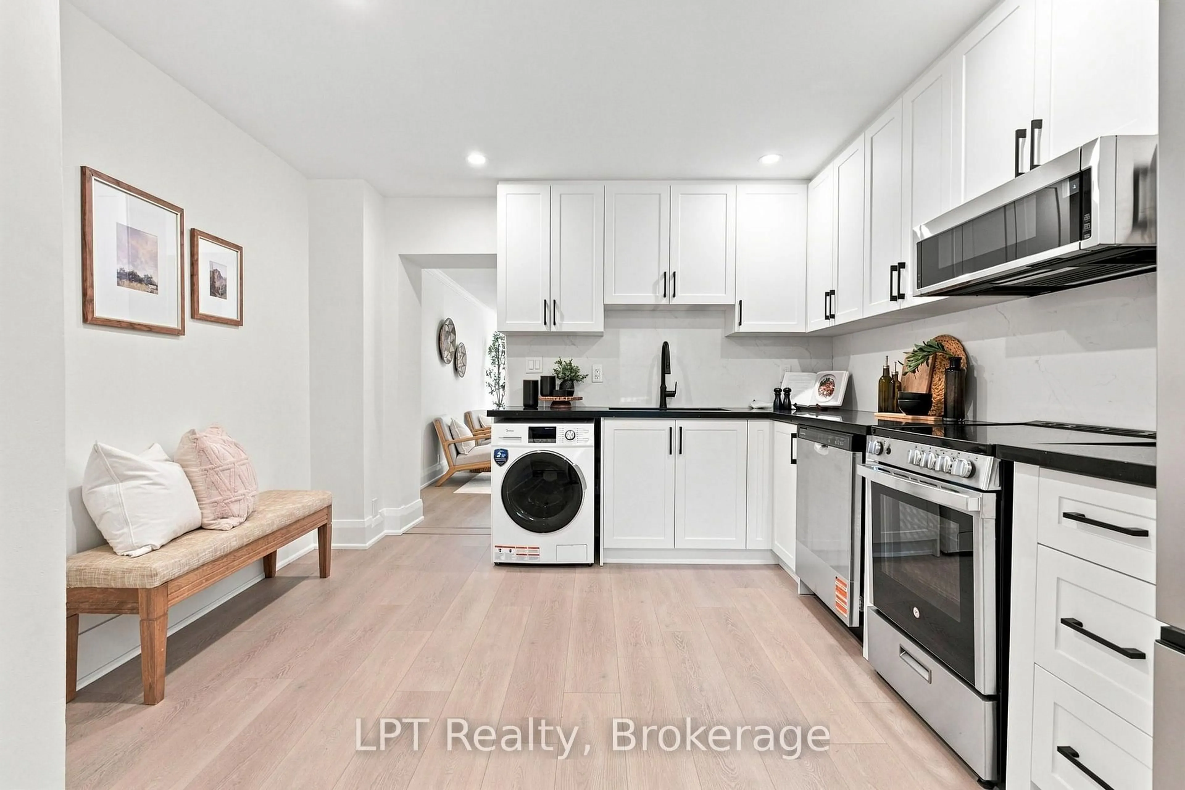 Open concept kitchen, wood/laminate floor for 112 Olive Ave, Oshawa Ontario L1H 2P2