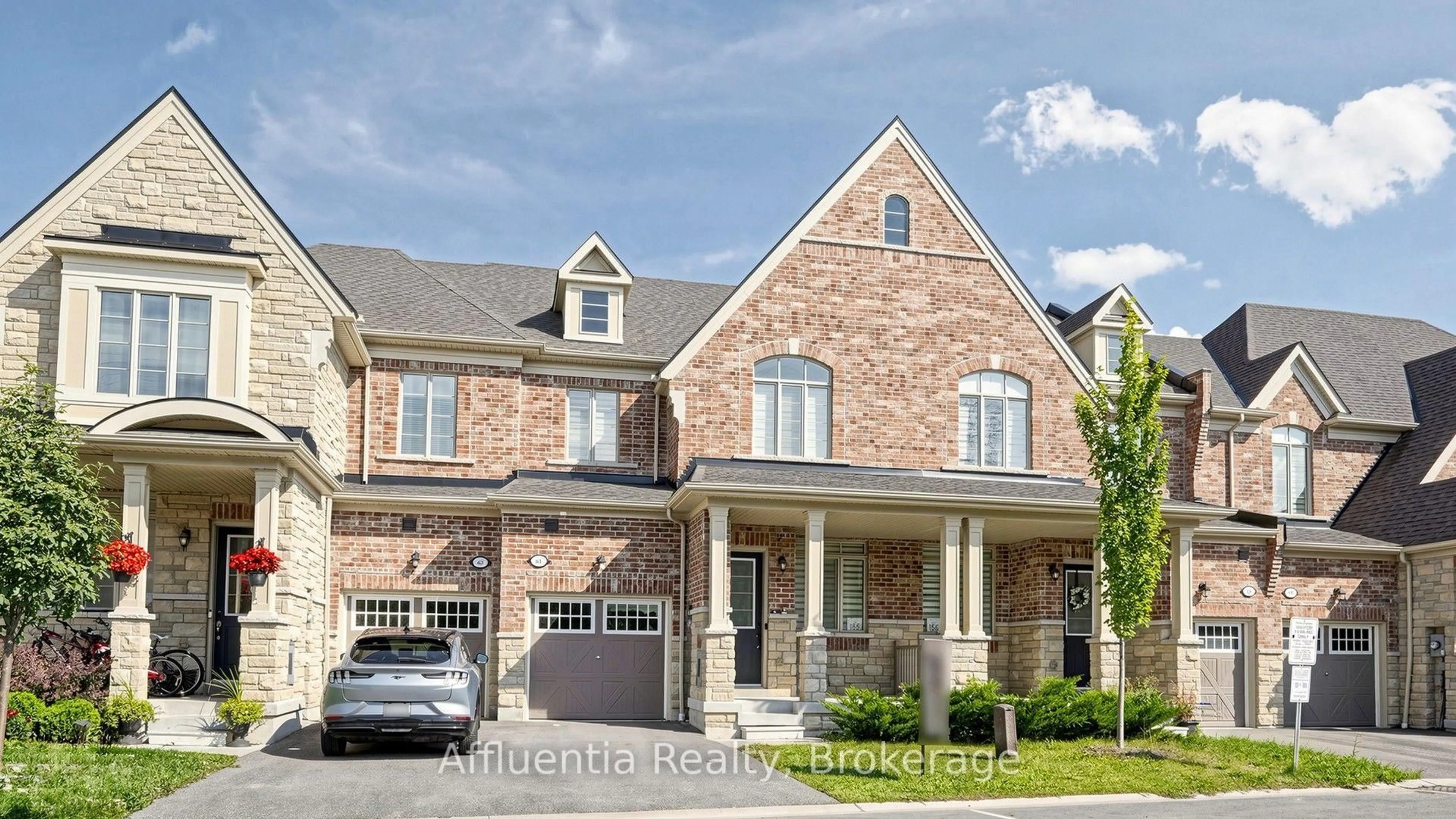 Home with brick exterior material, street for 61 Hickling Lane, Ajax Ontario L1T 4R1
