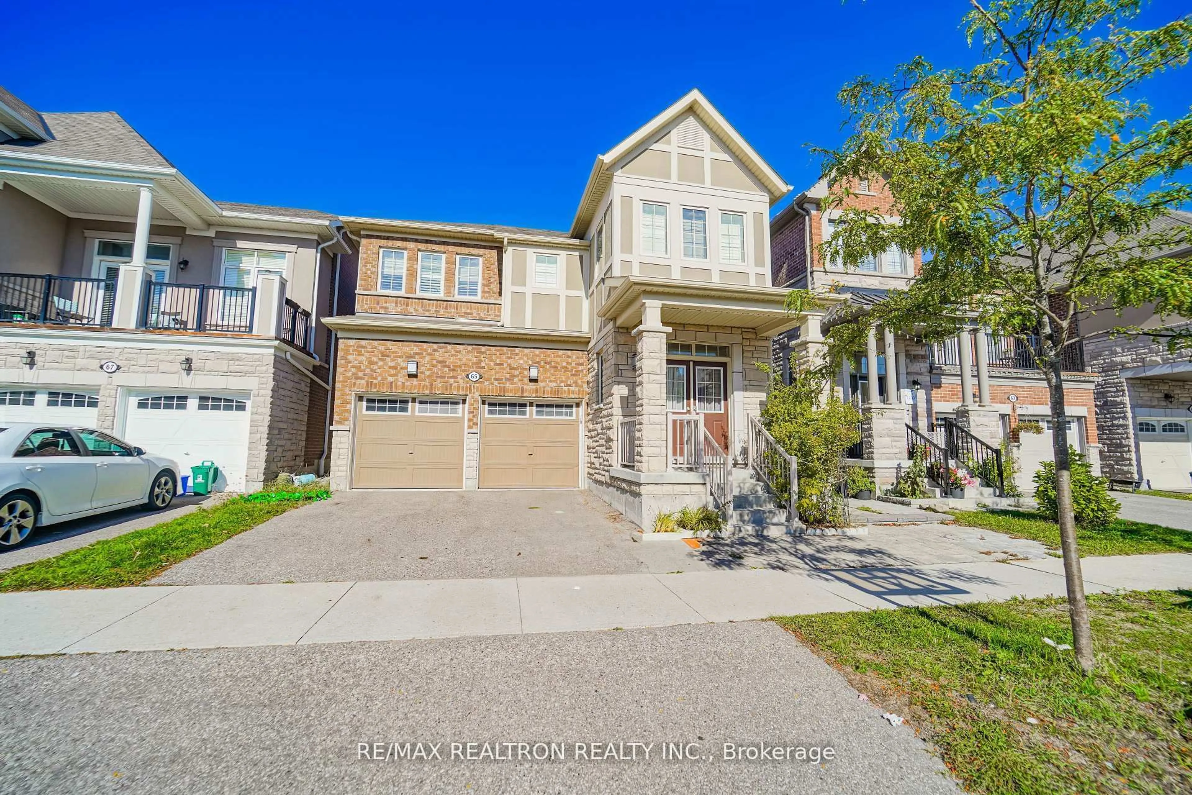 Home with brick exterior material, street for 65 Westfield Dr, Whitby Ontario L1P 0E9