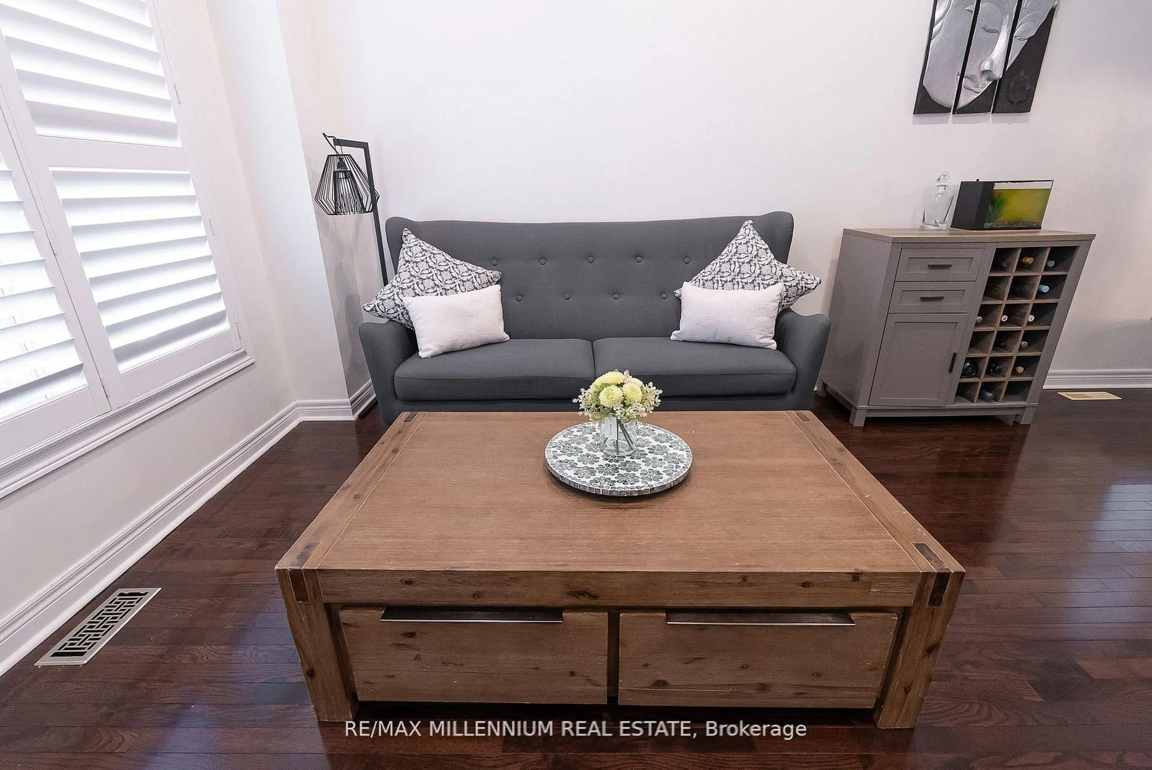 Living room with furniture, wood/laminate floor for 19 Bellotti Cres, Ajax Ontario L1Z 0M2
