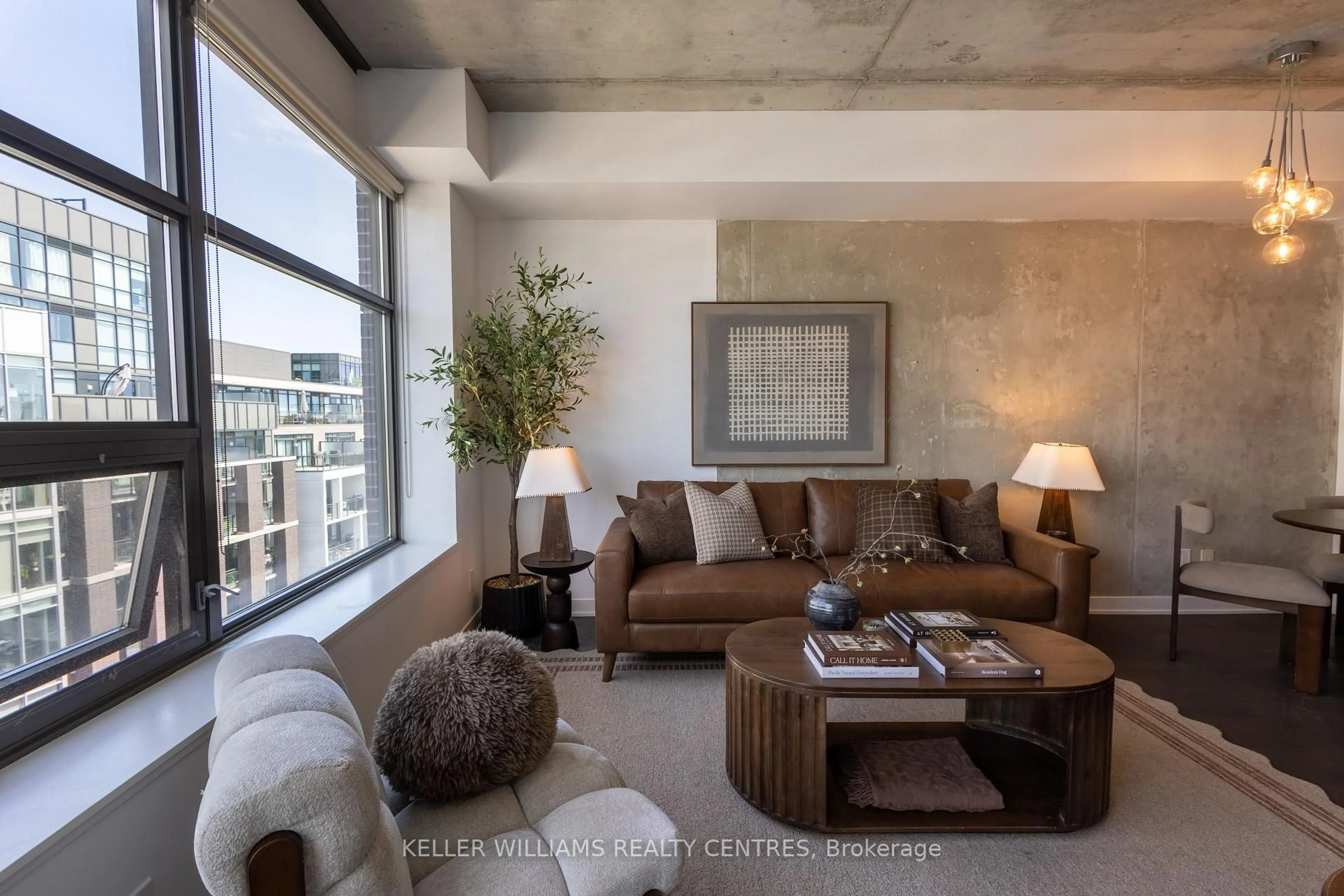 Living room with furniture, cement floor for 1201 Dundas St #806, Toronto Ontario M4M 1S2