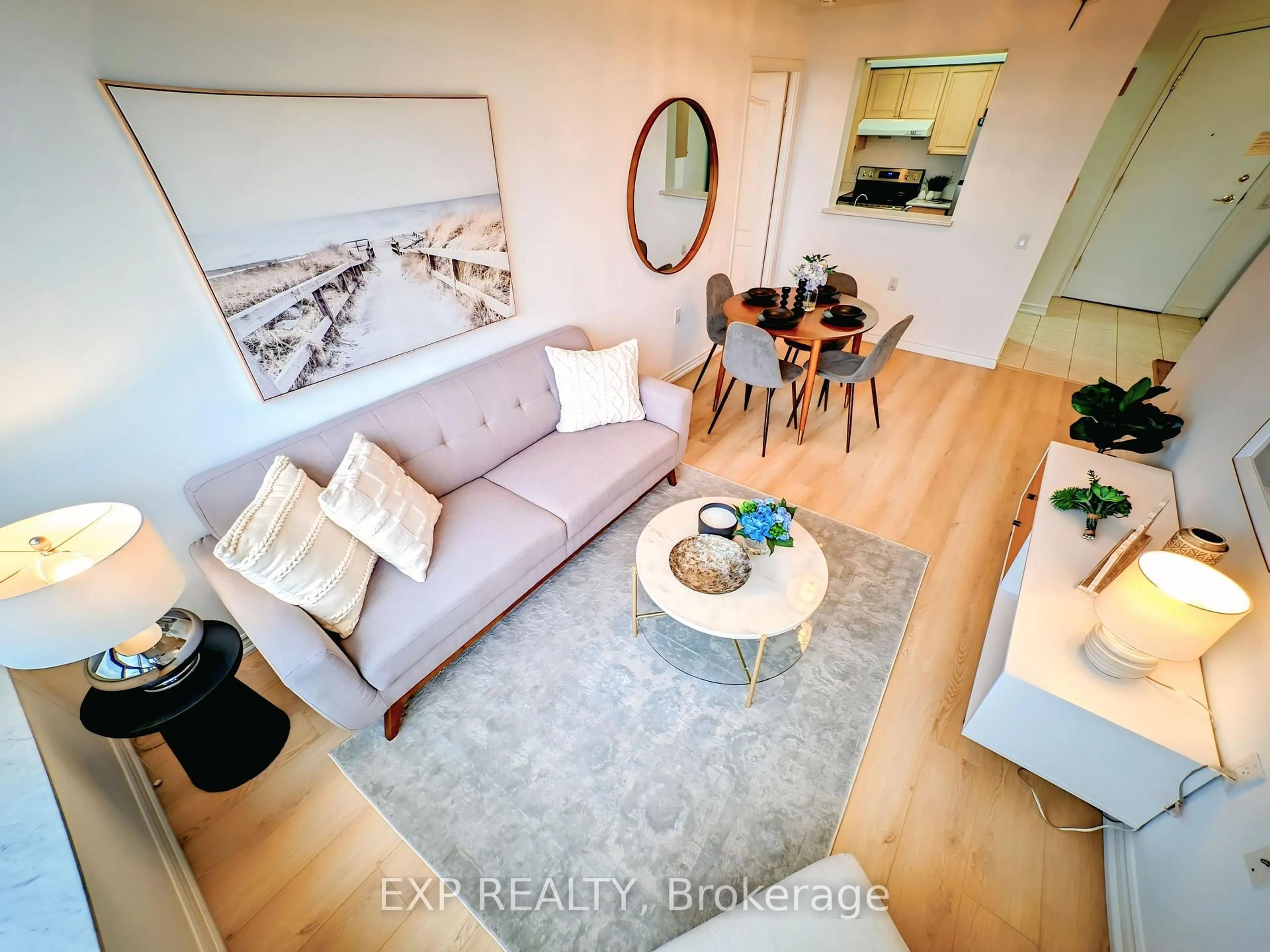 Living room with furniture, wood/laminate floor for 3088 Kennedy Rd #712, Toronto Ontario M1V 5M4