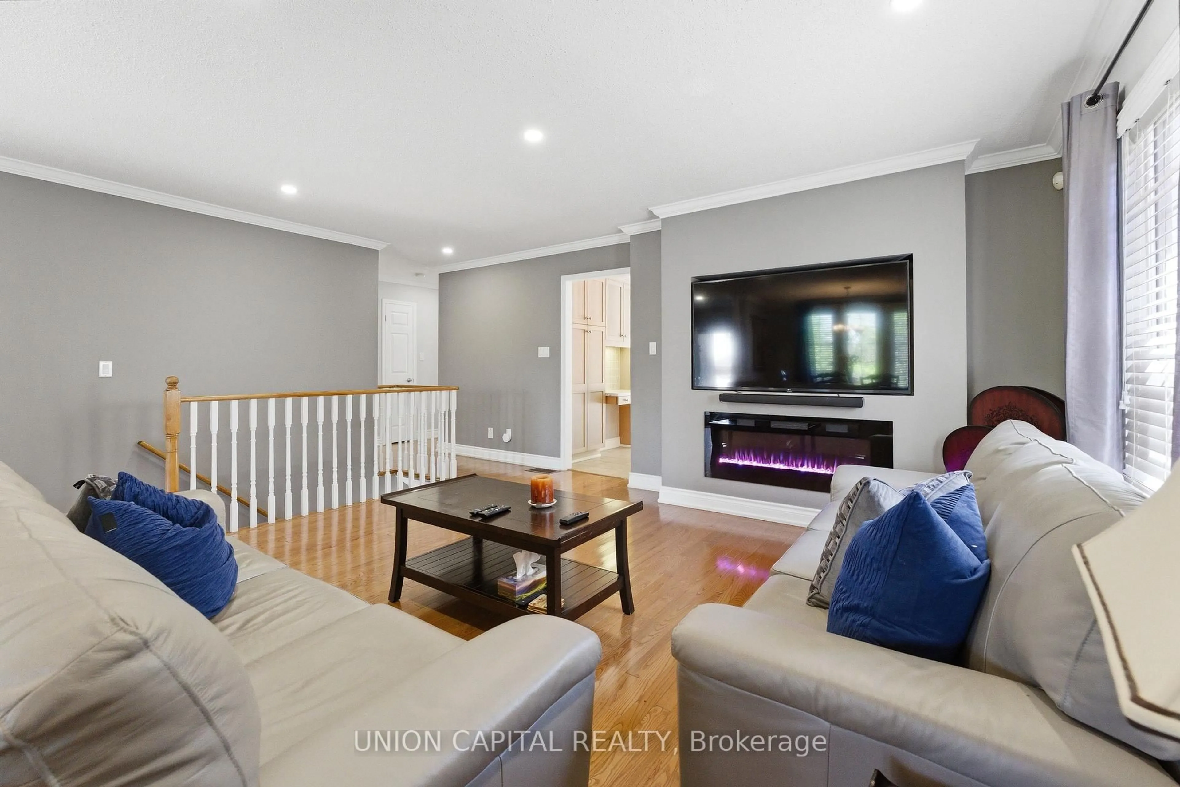 Living room with furniture, wood/laminate floor for 1473 Greenvalley Tr, Oshawa Ontario L1K 2N5