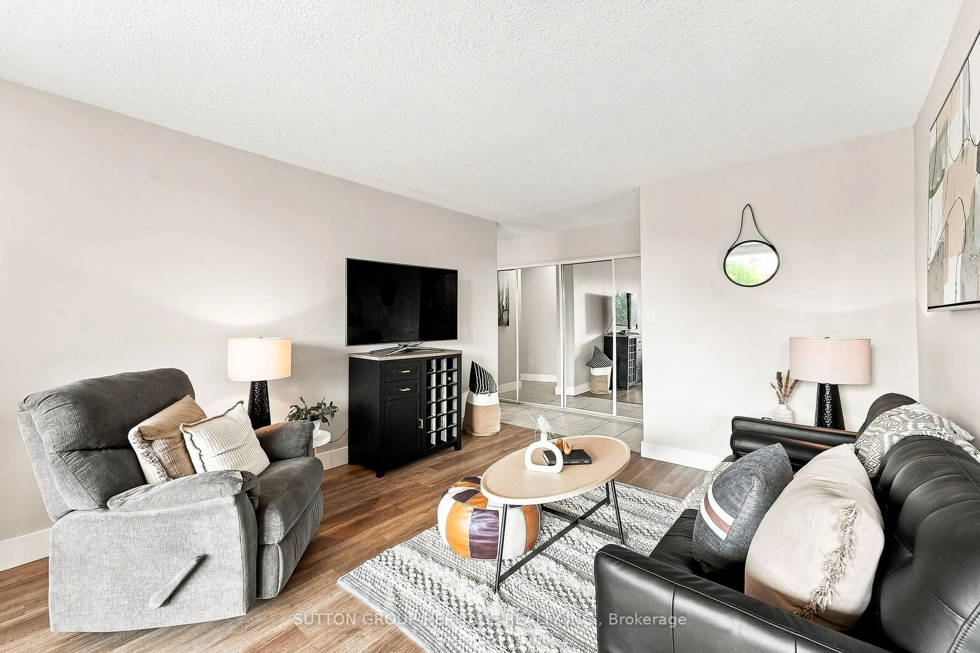 Living room with furniture, wood/laminate floor for 92 Church St #301, Ajax Ontario L1S 6B4