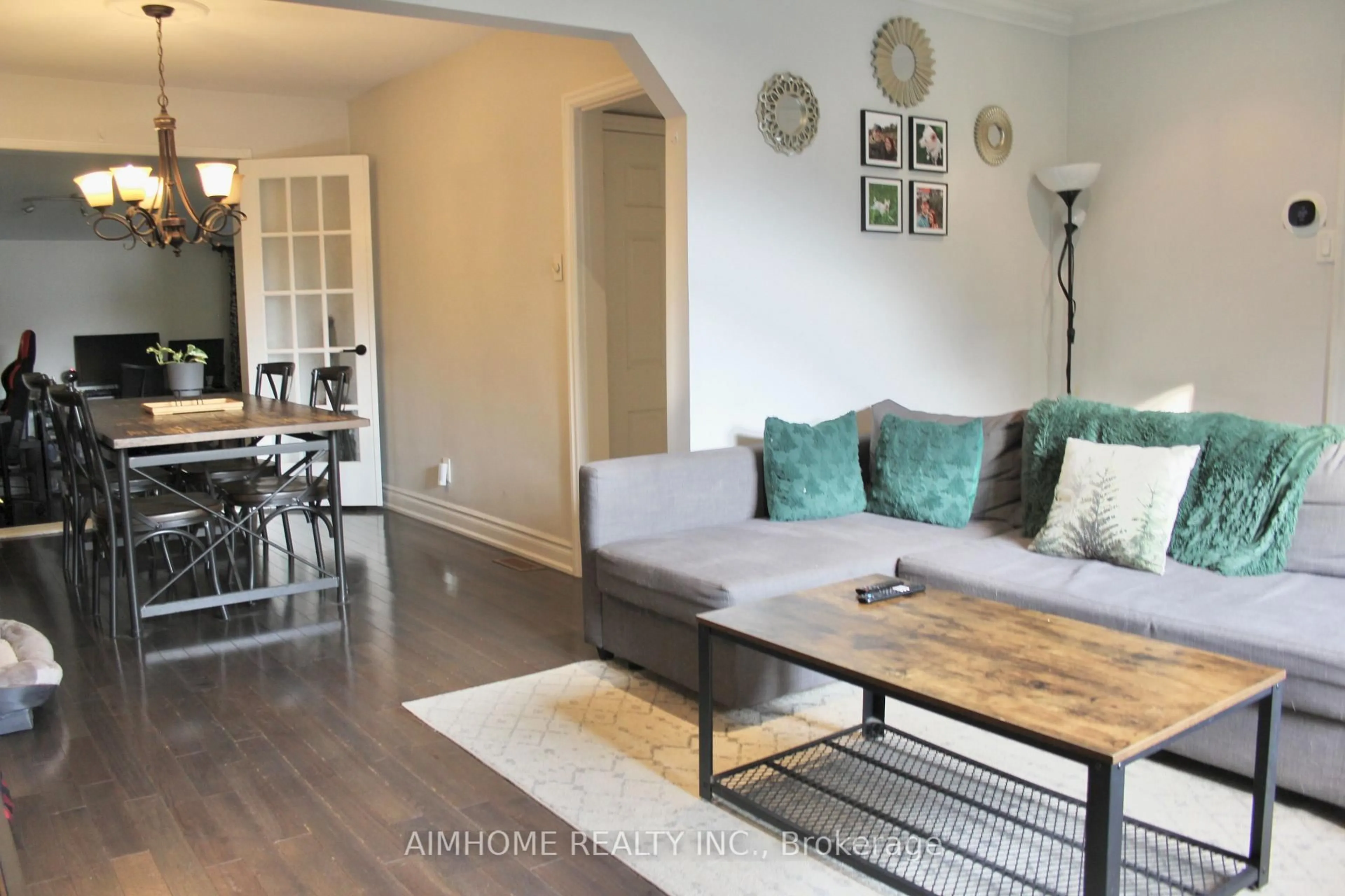 Living room with furniture, wood/laminate floor for 31 Camilla Cres, Toronto Ontario M1L 1Y9