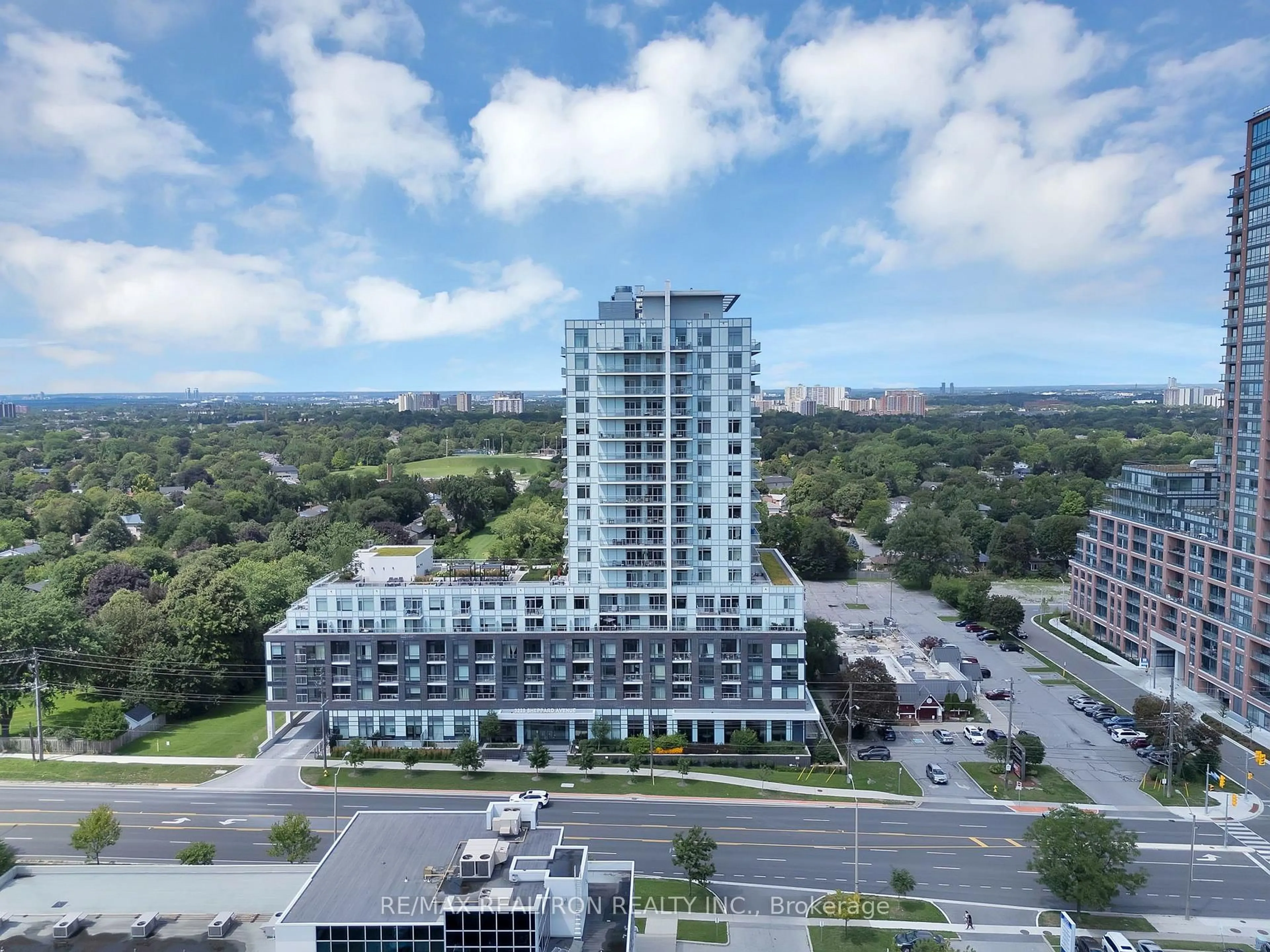 A pic from outside/outdoor area/front of a property/back of a property/a pic from drone, city buildings view from balcony for 3220 Sheppard Ave #1702, Toronto Ontario M1T 0B7