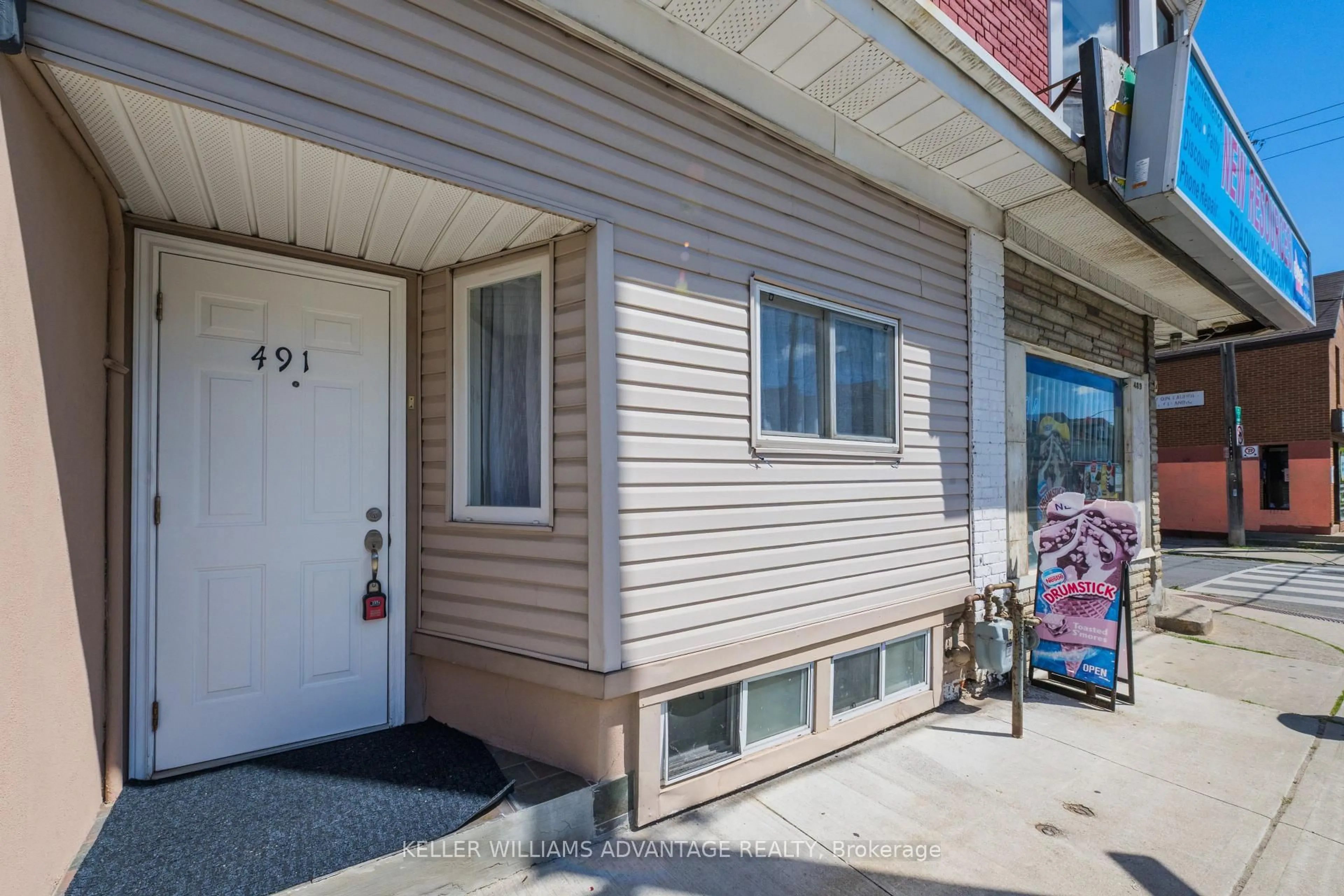 Home with vinyl exterior material, street for 491 Jones Ave, Toronto Ontario M4J 3G8