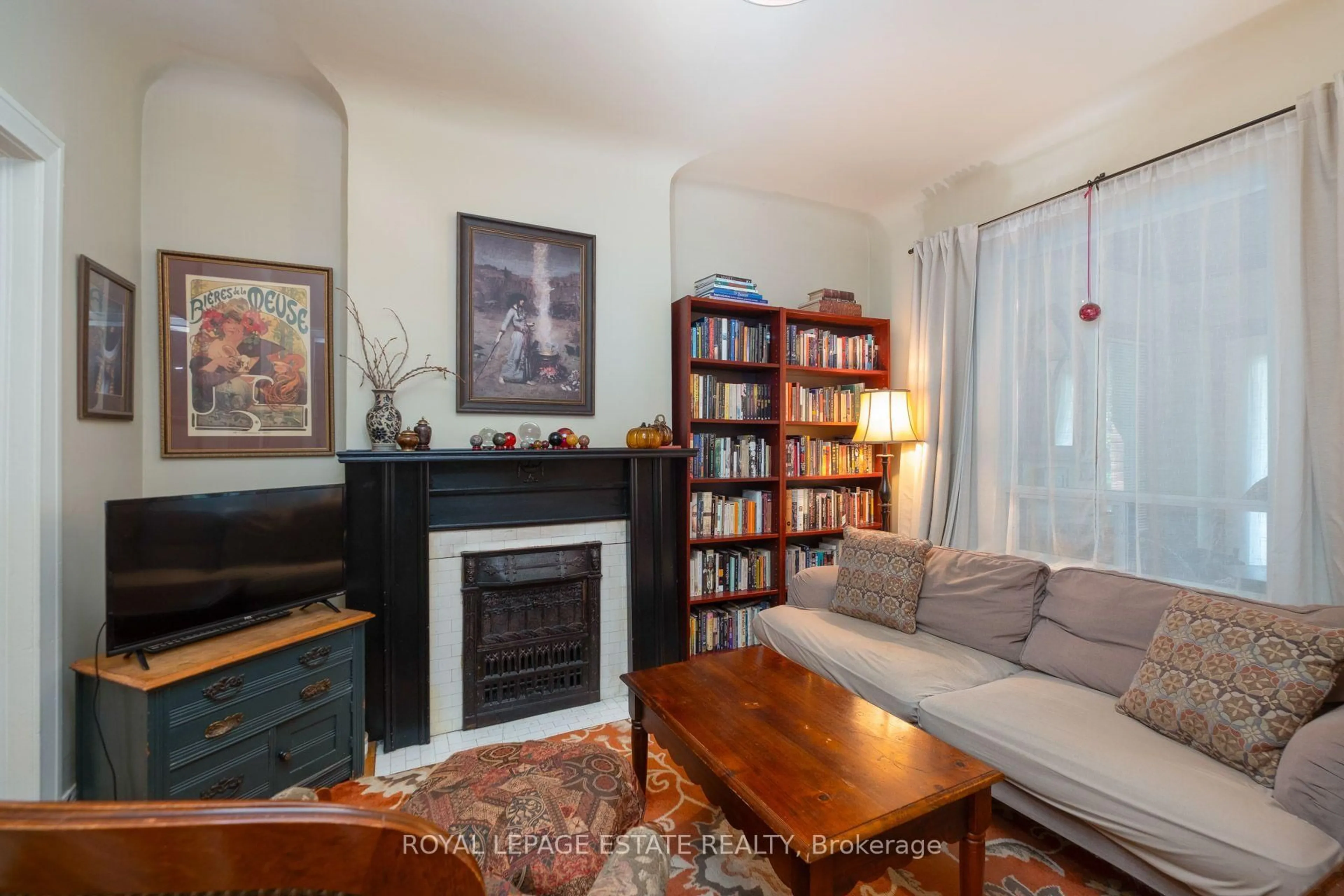 Living room with furniture, wood/laminate floor for 57 Herbert Ave, Toronto Ontario M4L 3P8