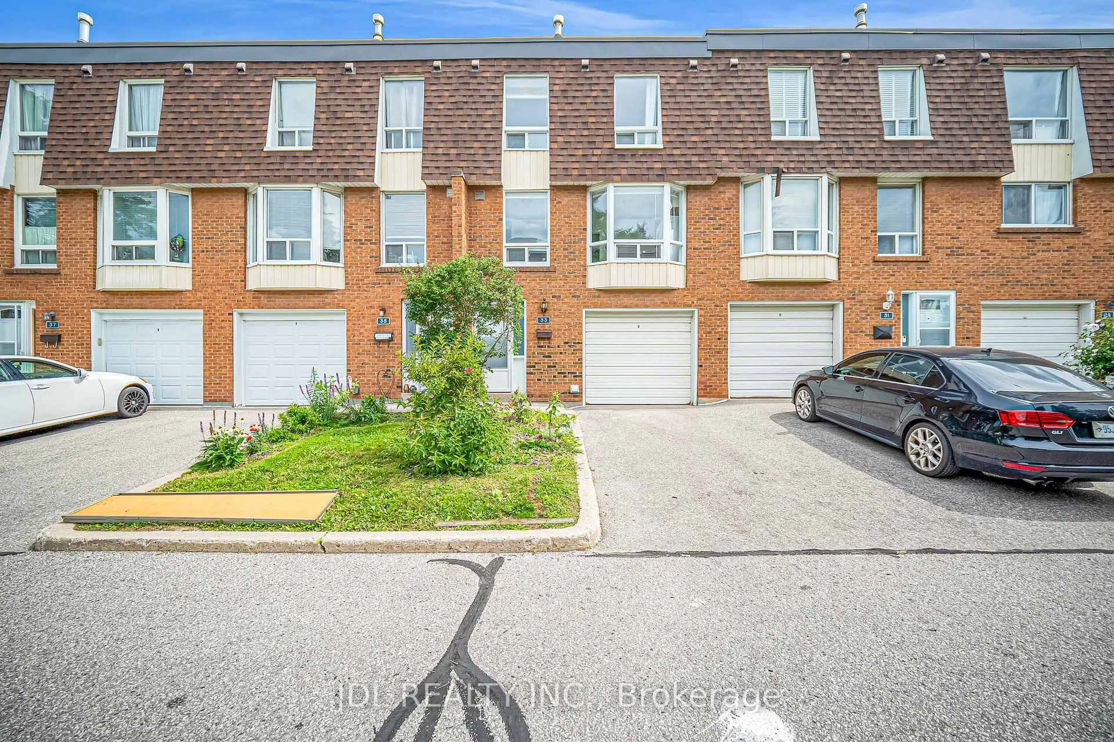 A pic from outside/outdoor area/front of a property/back of a property/a pic from drone, street for 100 Bridletowne Circ #33, Toronto Ontario M1W 2G8