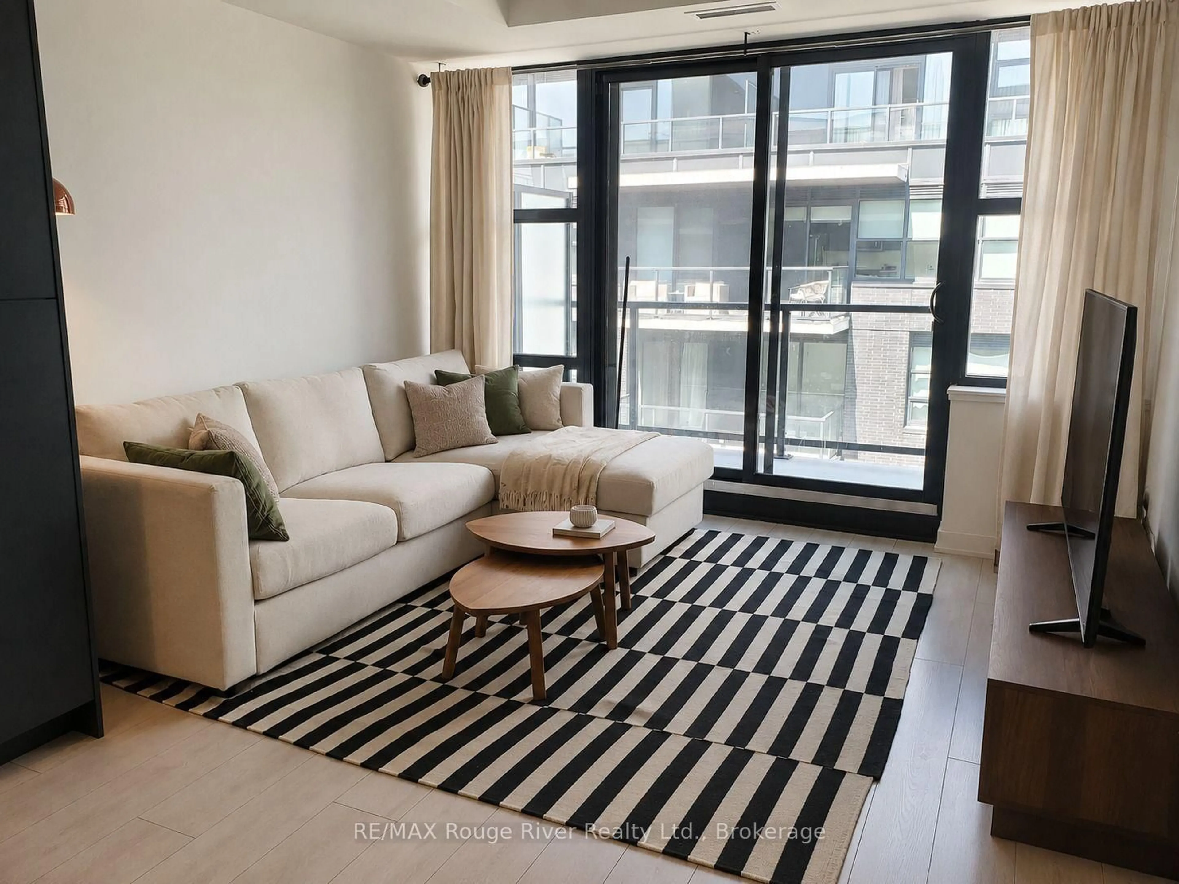 Living room with furniture, carpet floor for 1614 Charles St #439, Whitby Ontario L1N 0P4