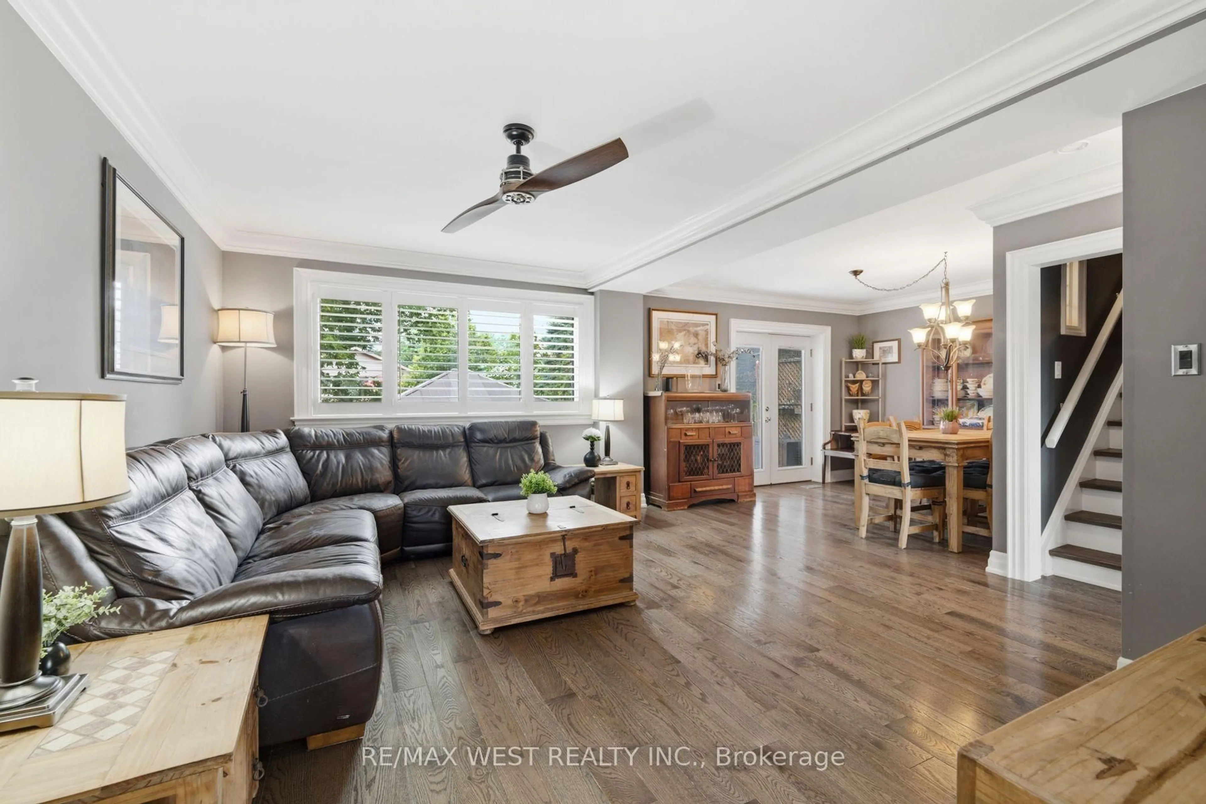 Living room with furniture, wood/laminate floor for 16 Shediac Rd, Toronto Ontario M1K 4Z7