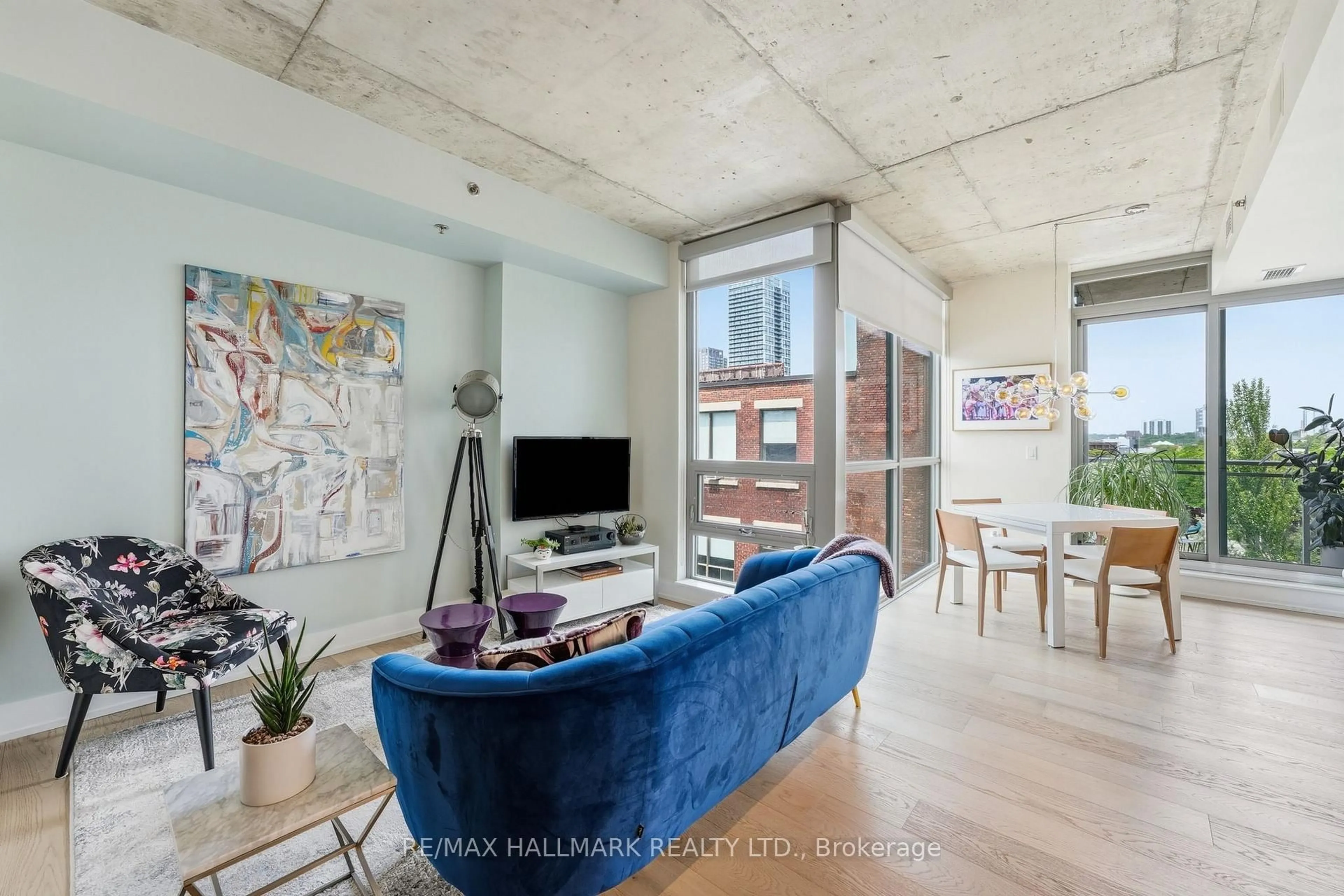 Living room with furniture, cement floor for 630 Queen St #602, Toronto Ontario M4M 1G3