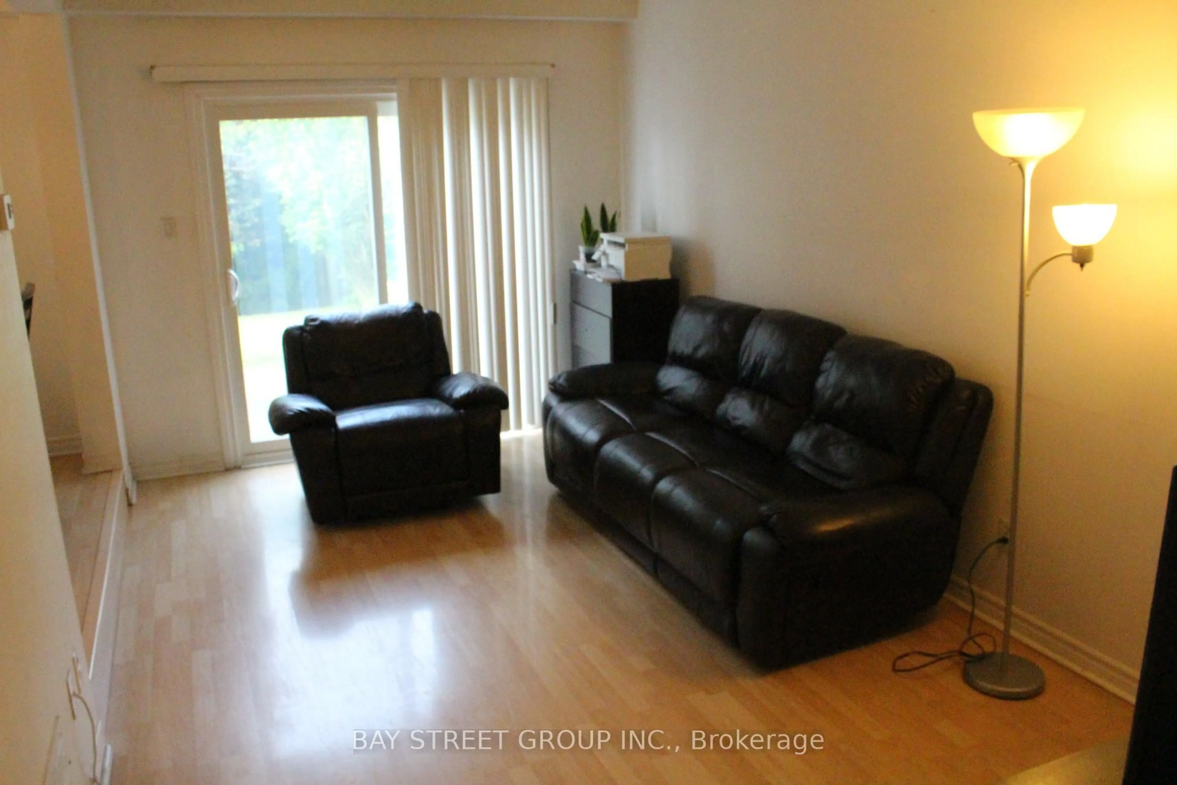 Living room with furniture, wood/laminate floor for 29 Fundy Bay Blvd #44, Toronto Ontario M1W 3A2